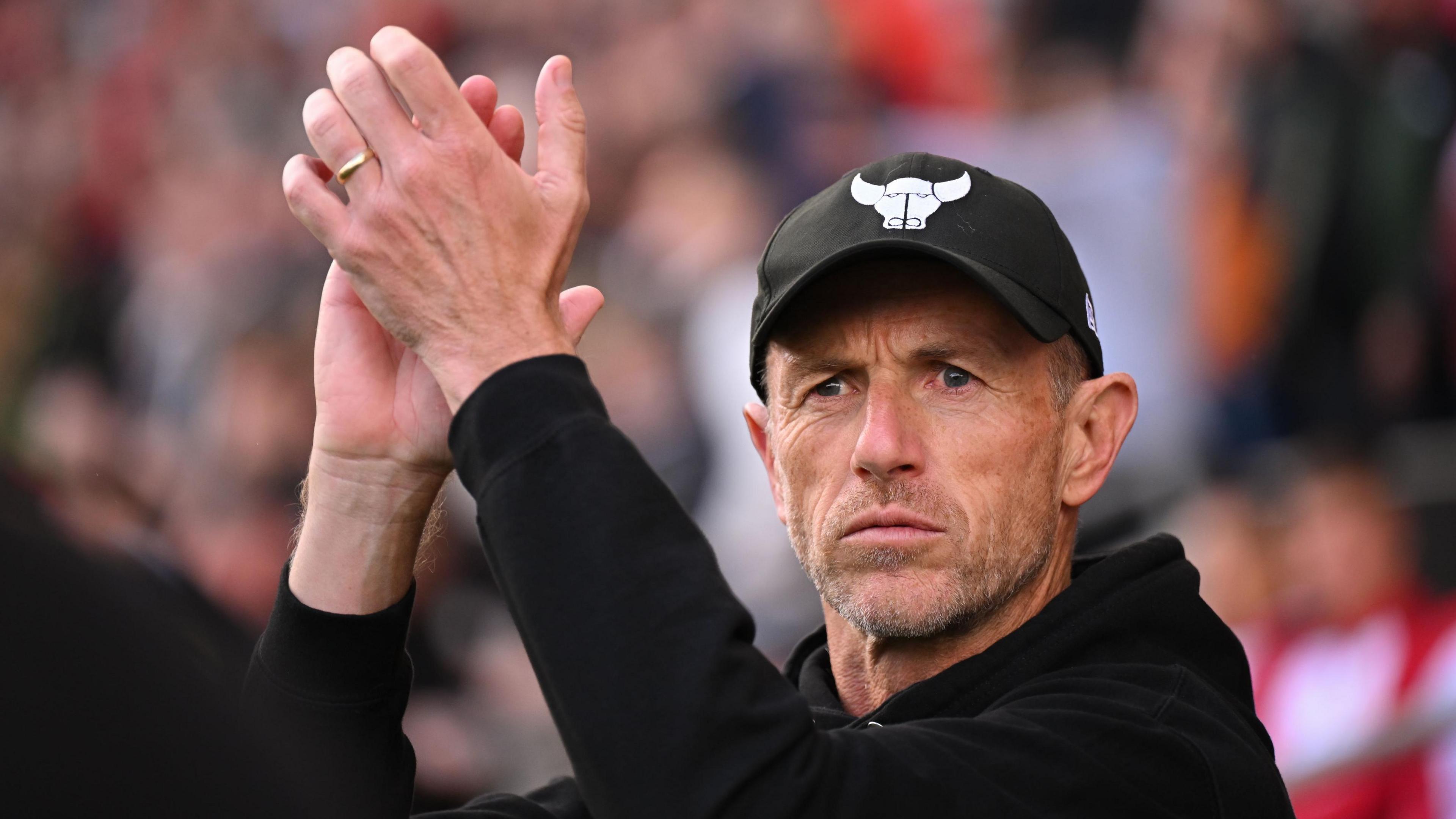 Gary Rowett claps his hands at fans