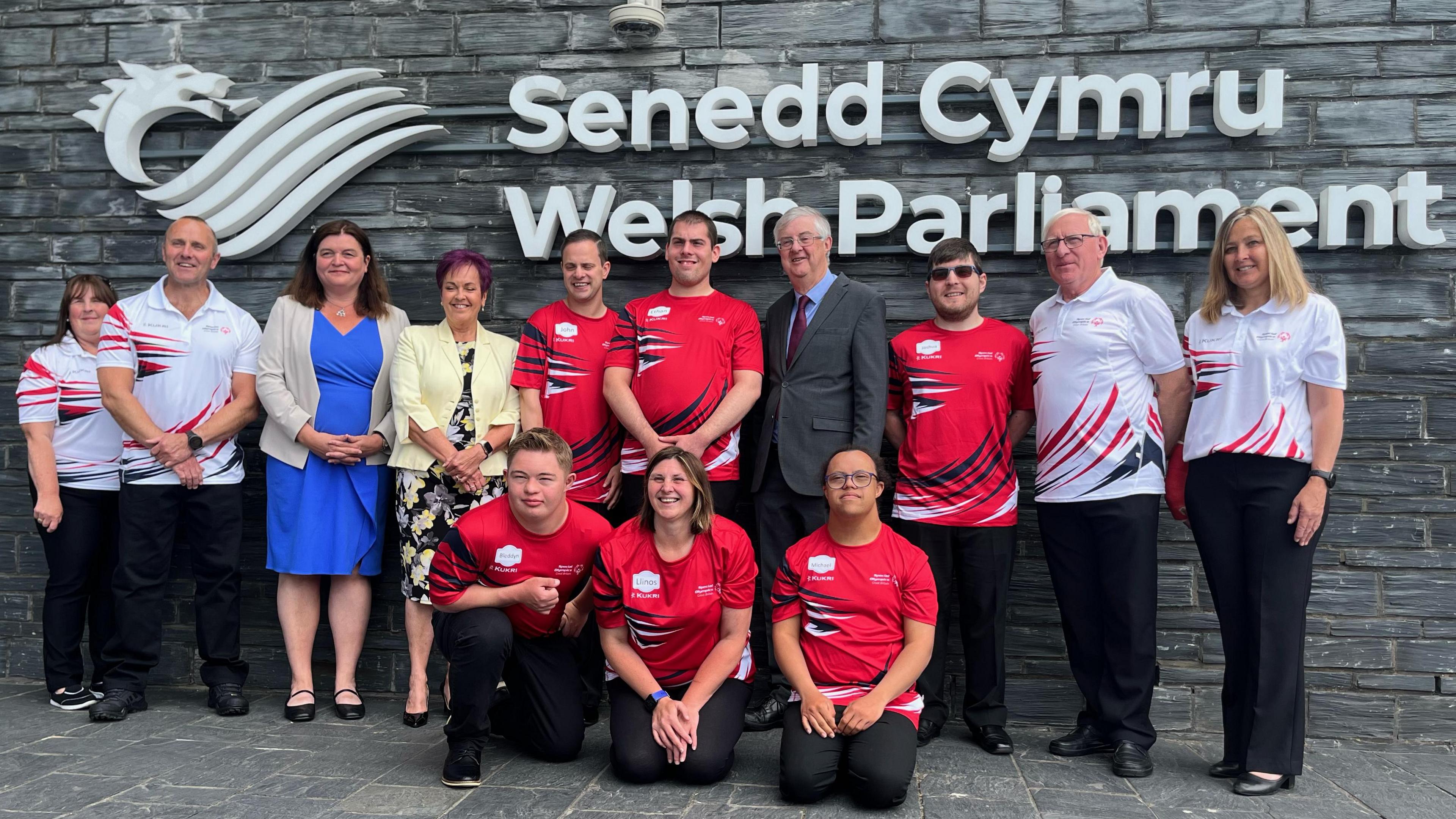 Athletes, MS's and volunteers stood outside the Senedd