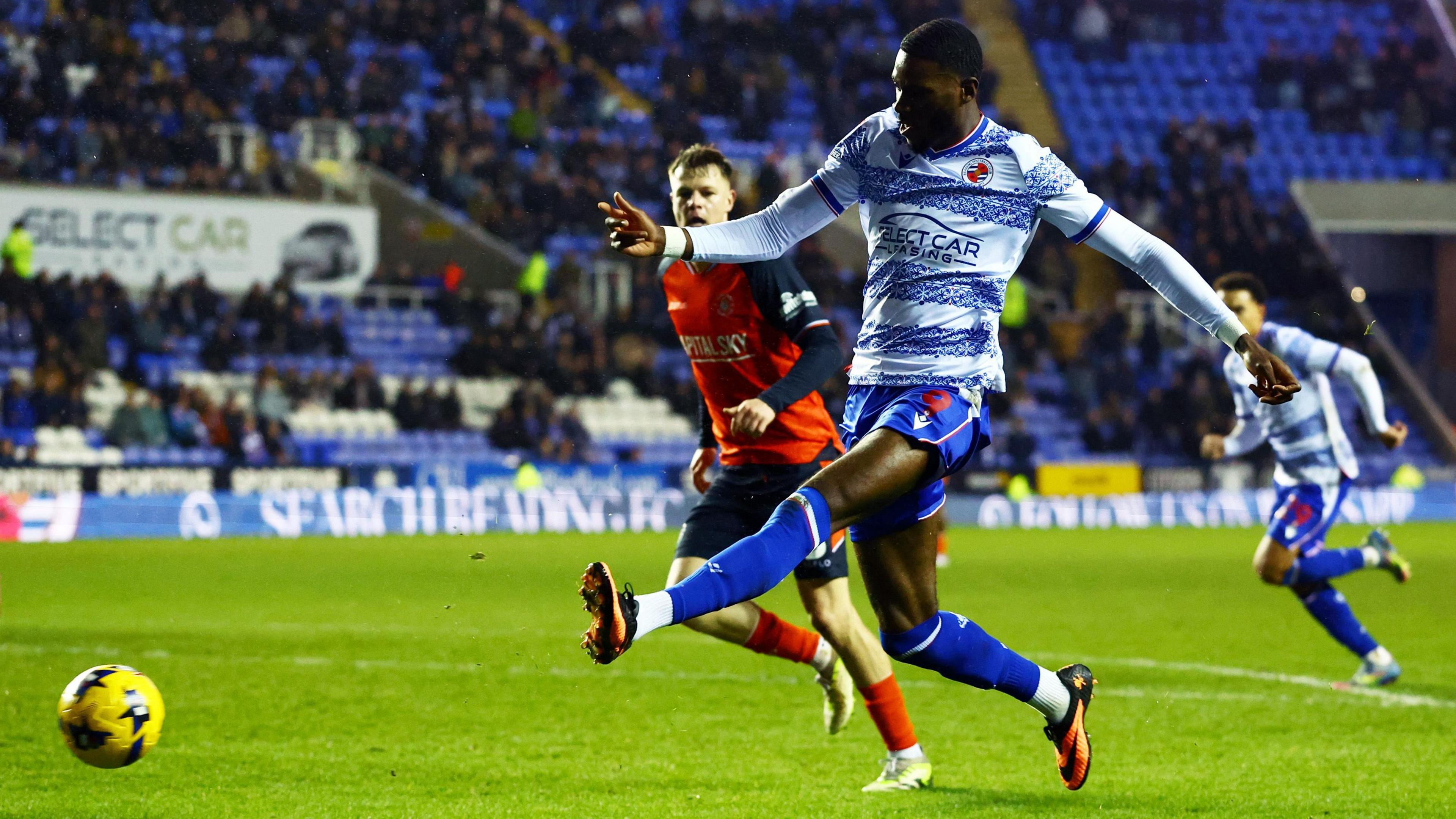 Kelvin Ehibhatiomhan scores Reading's third goal against Luton
