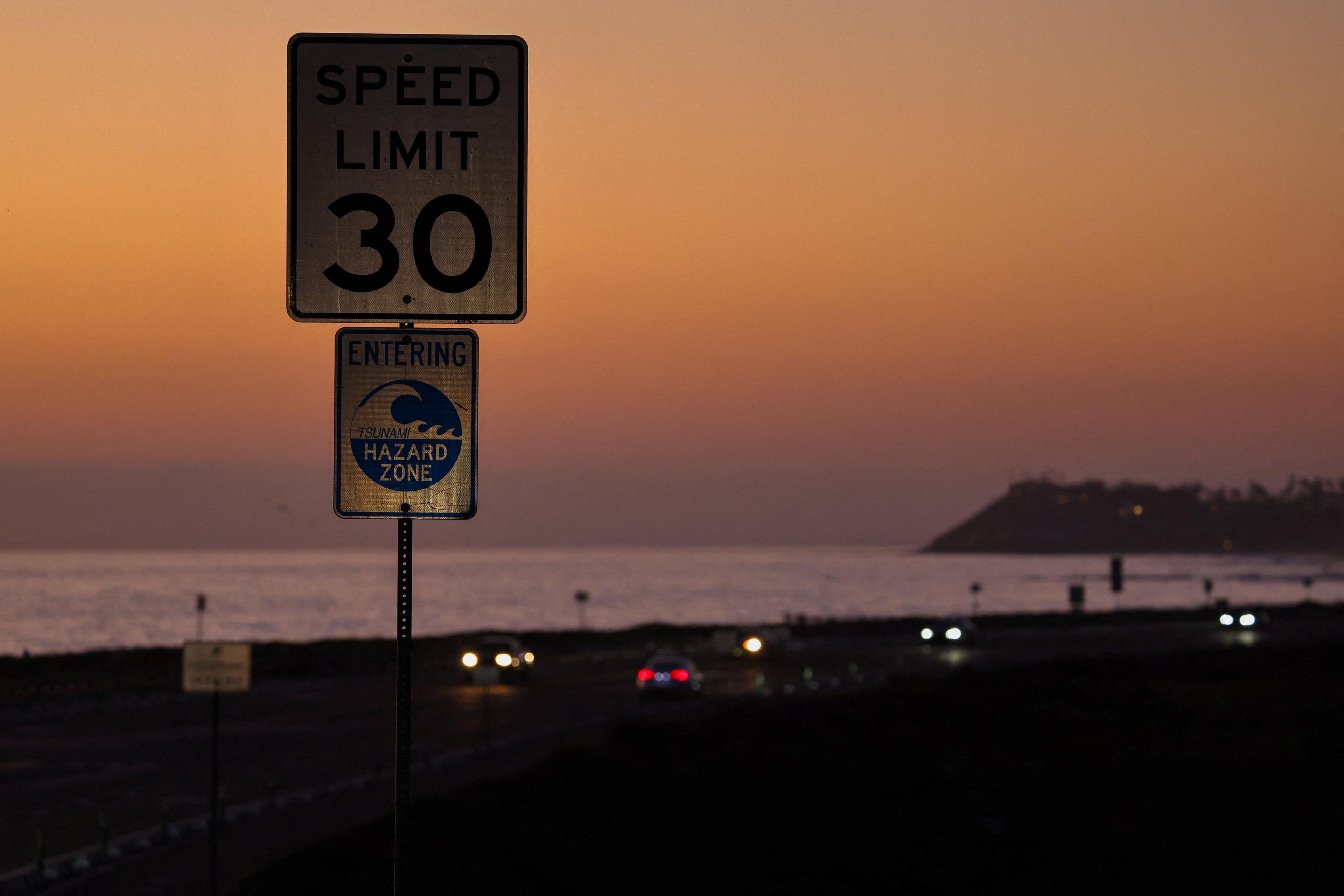 A tsunami warning sign is shown on the Pacific Coast Highway in California.