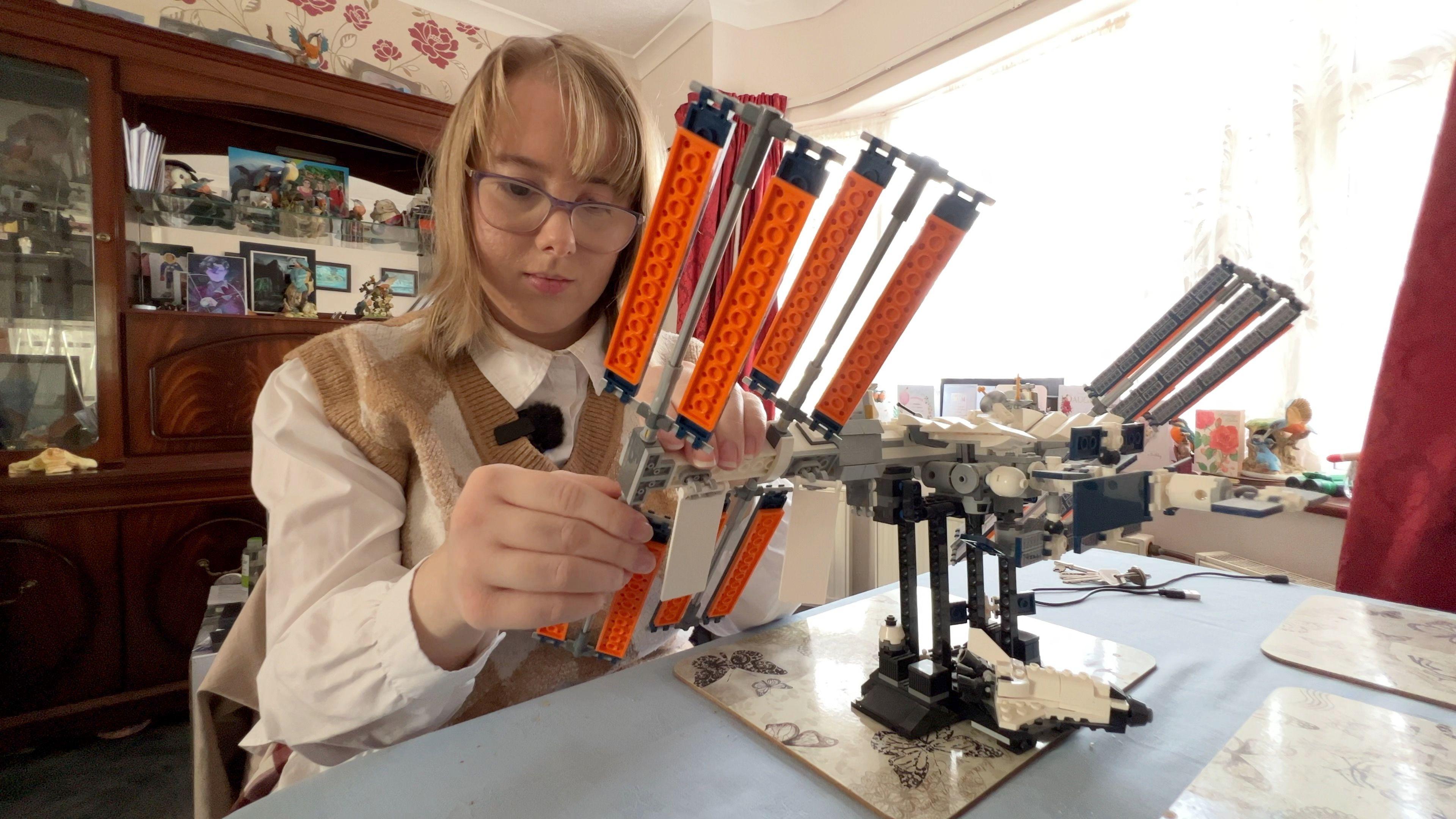 Sophie Brudenall buildinga model of the International Space Station