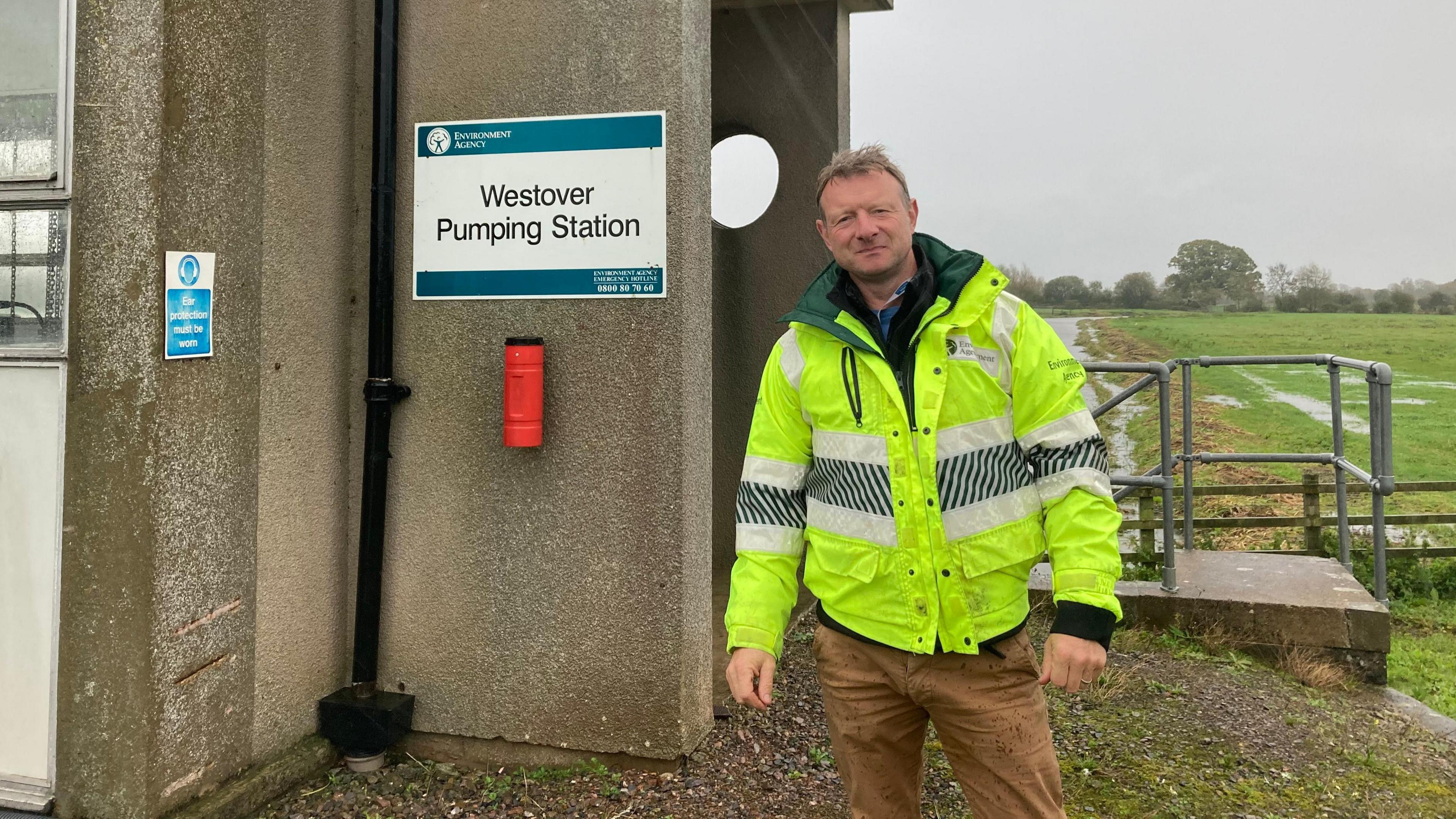 Man stood in front of pumping station