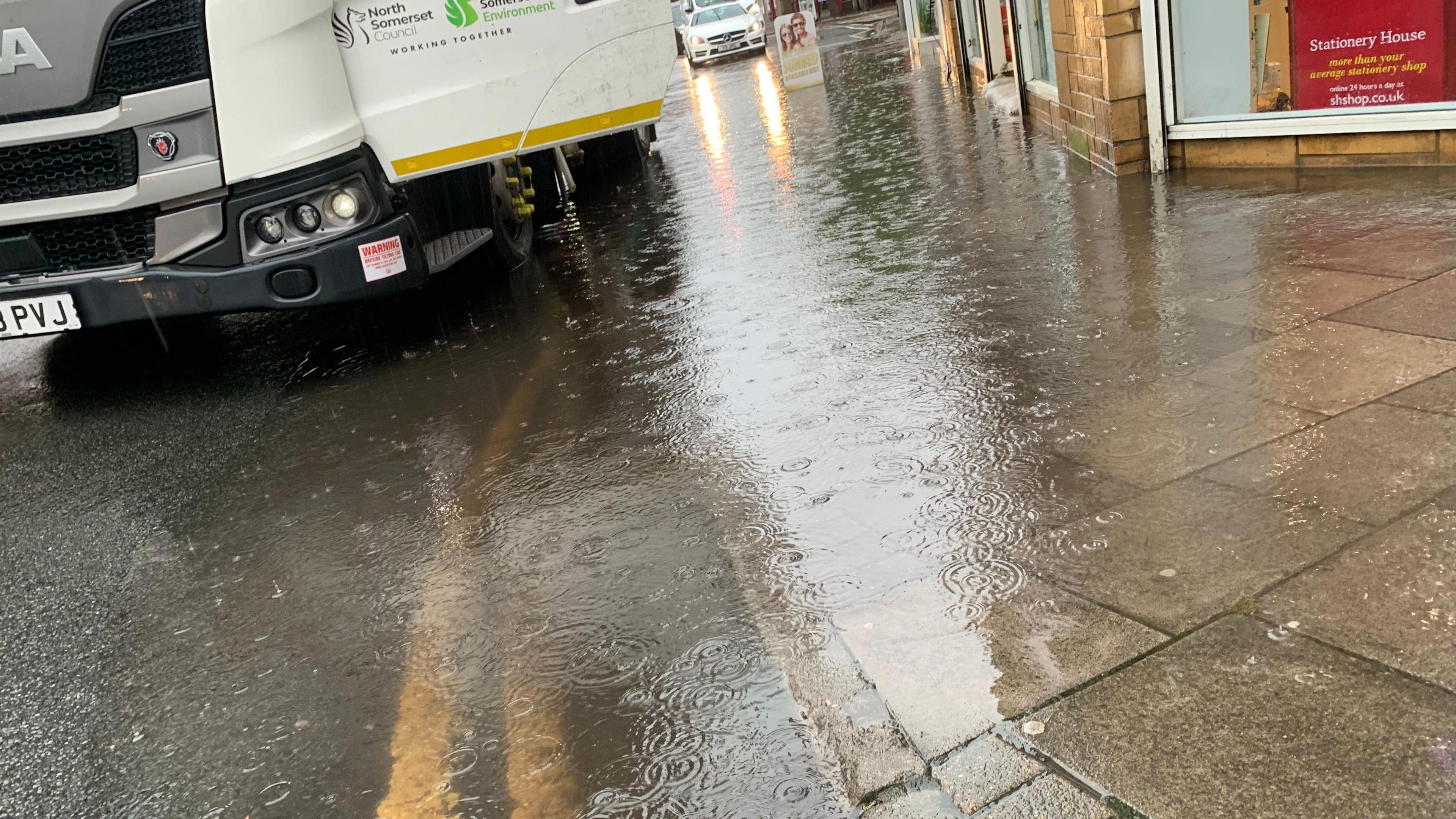 A flooded road and pavement after heavy rain hit the Triangle in Clevedon