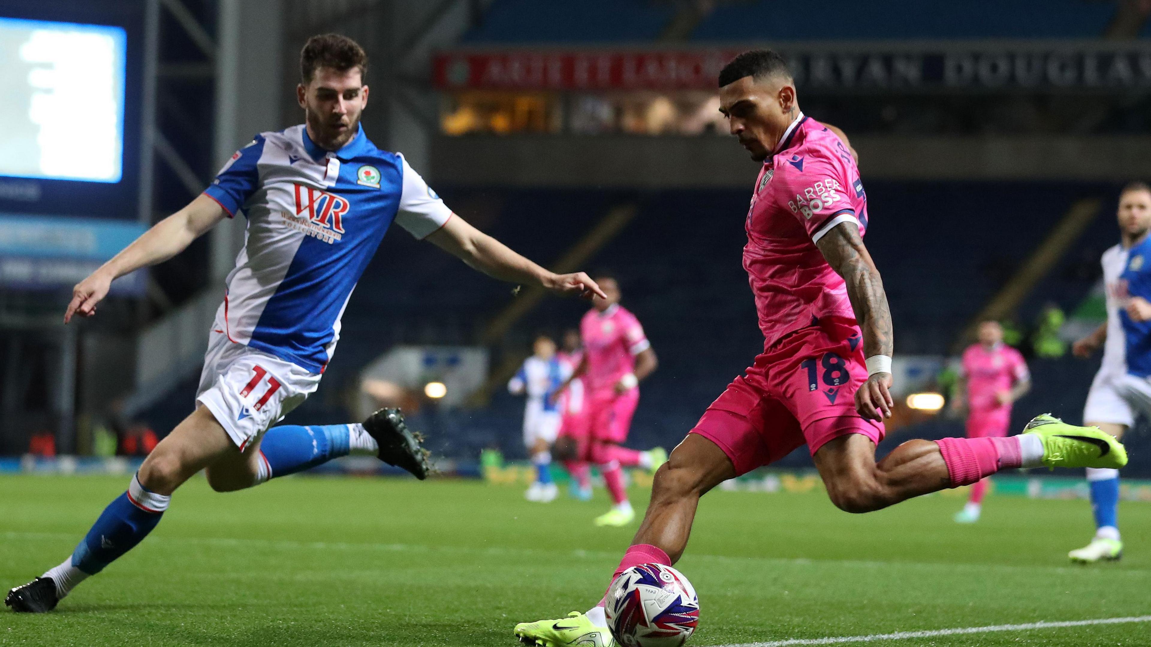 Blackburn Rovers' Joe Rankin-Costello attempts to halt West Bromwich Albion's Karlan Grant