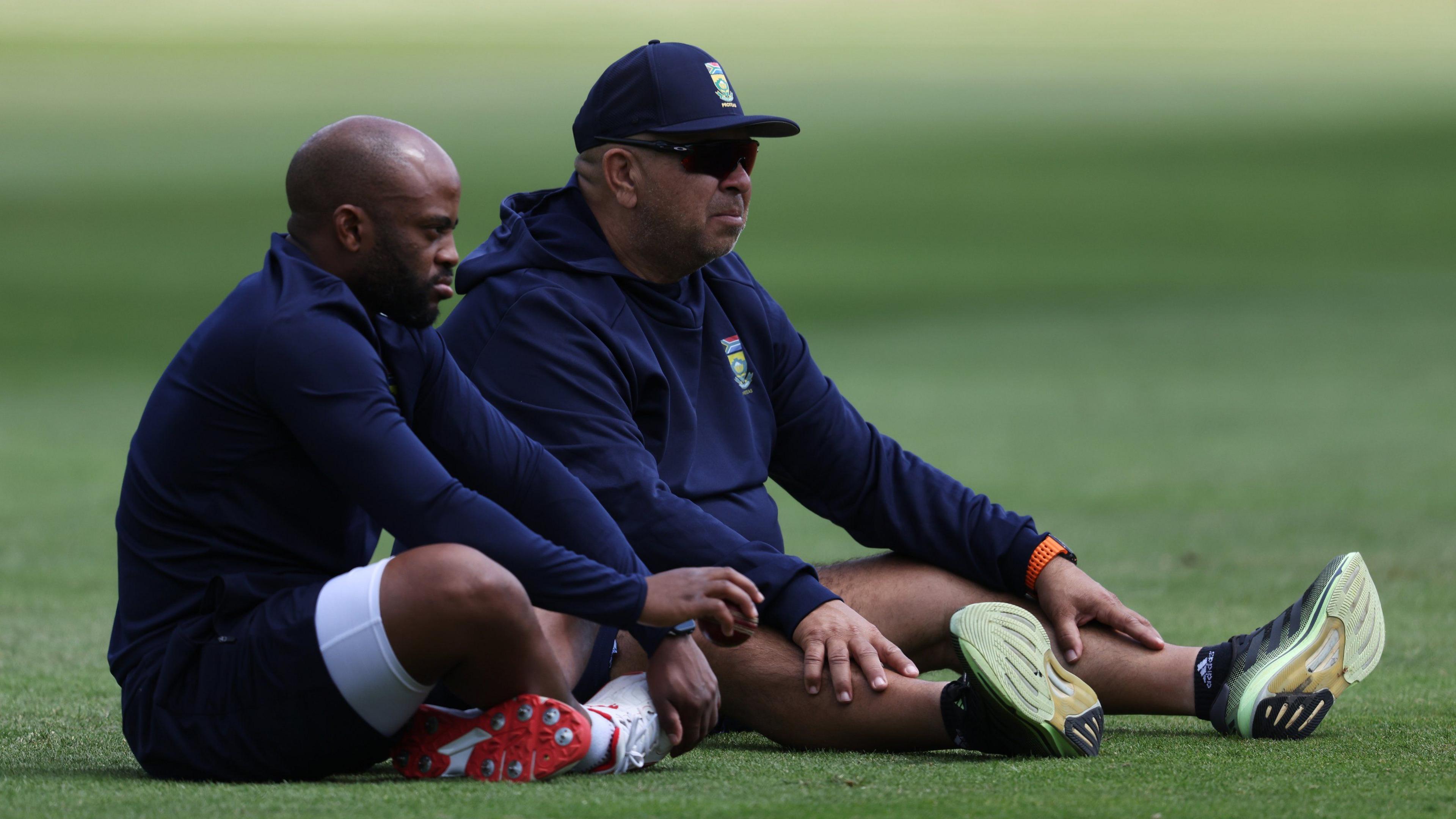 South Africa Test captain Temba Bavuma (left) sits next to head coach Shukri Conrad (right)