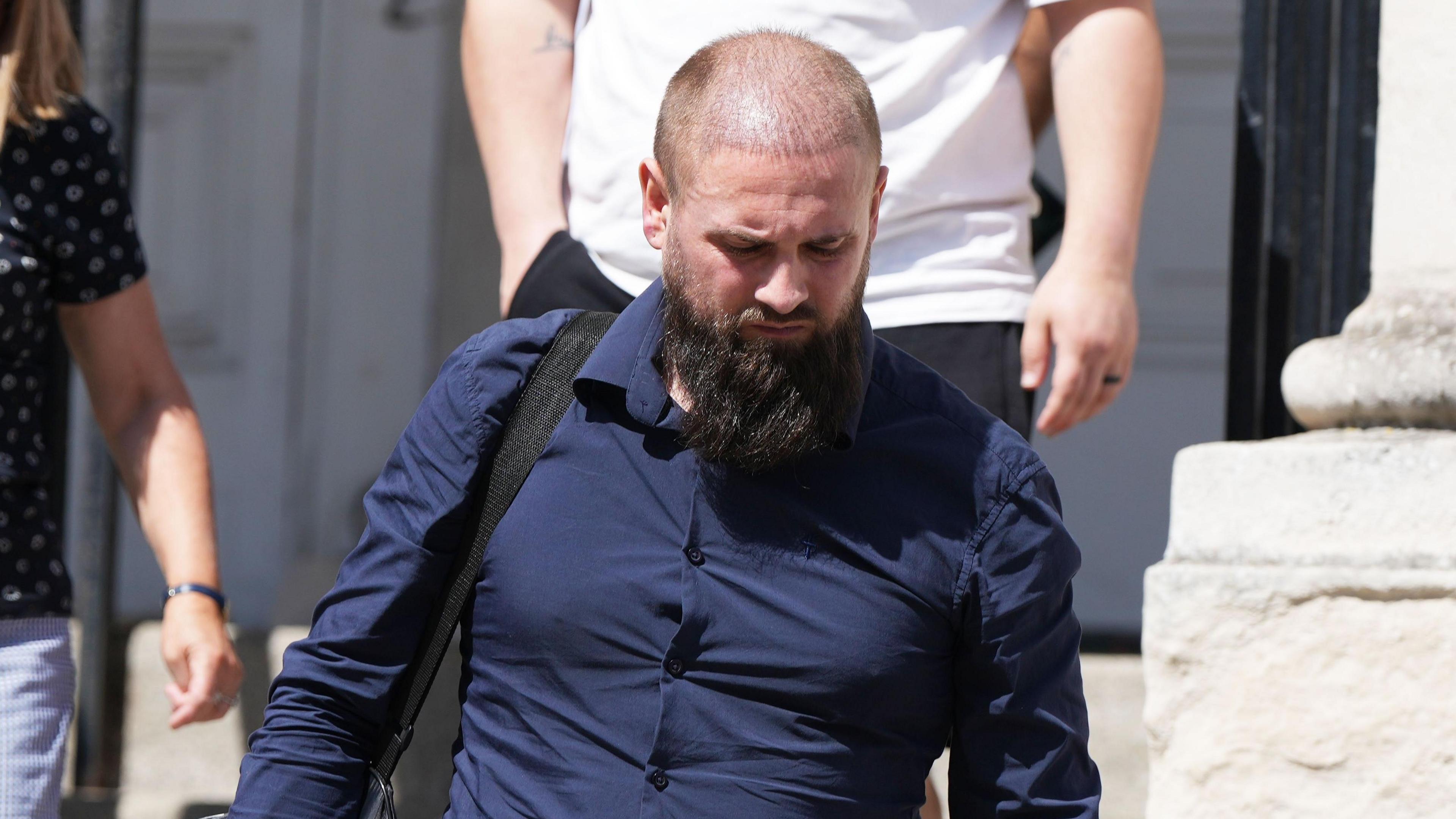 Adam Reid pictured arriving at Lewes Crown Court in Lewes, East Sussex.