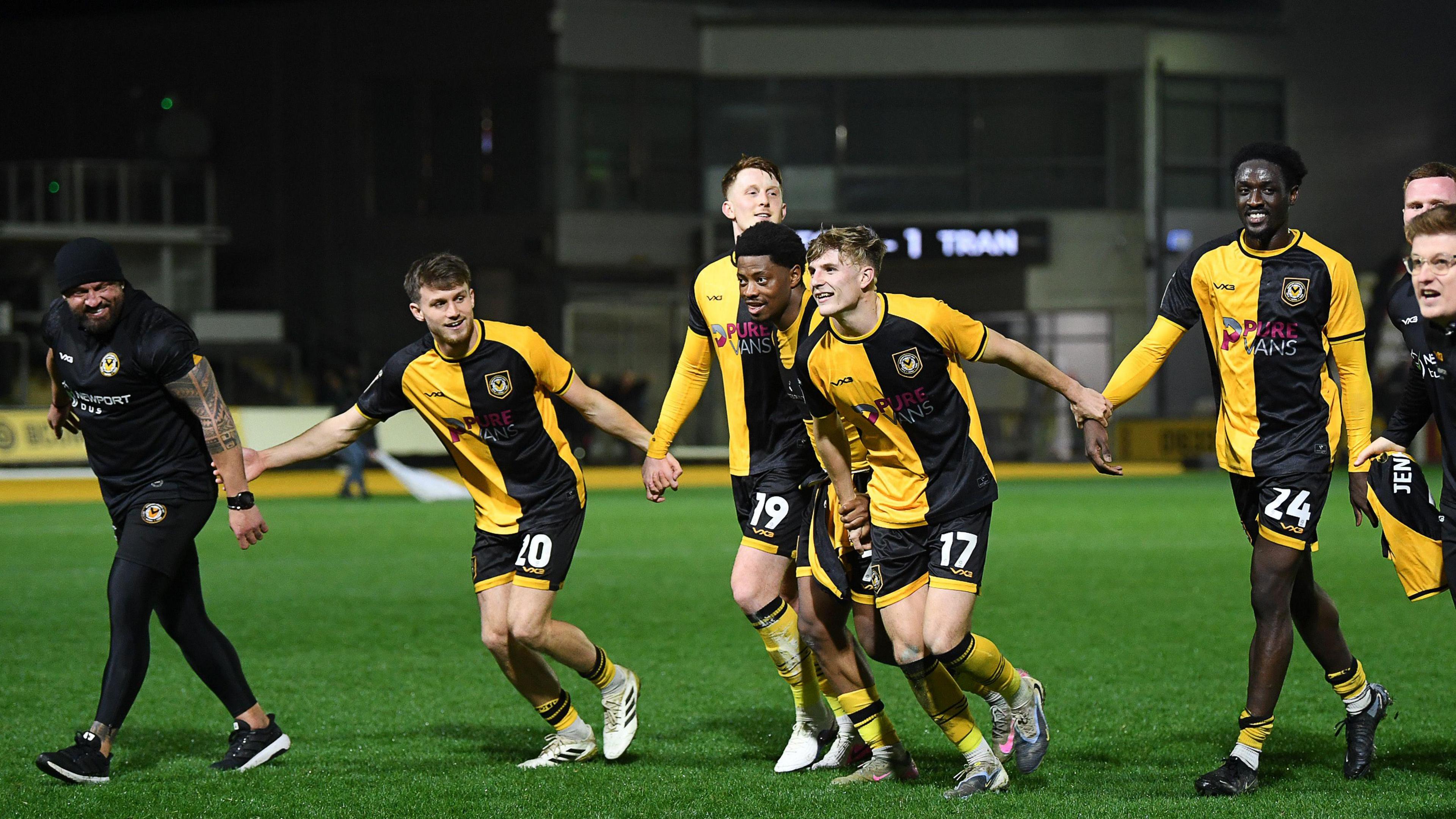 County players celebrate at Rodney parade in front of jubilant traveling fans.