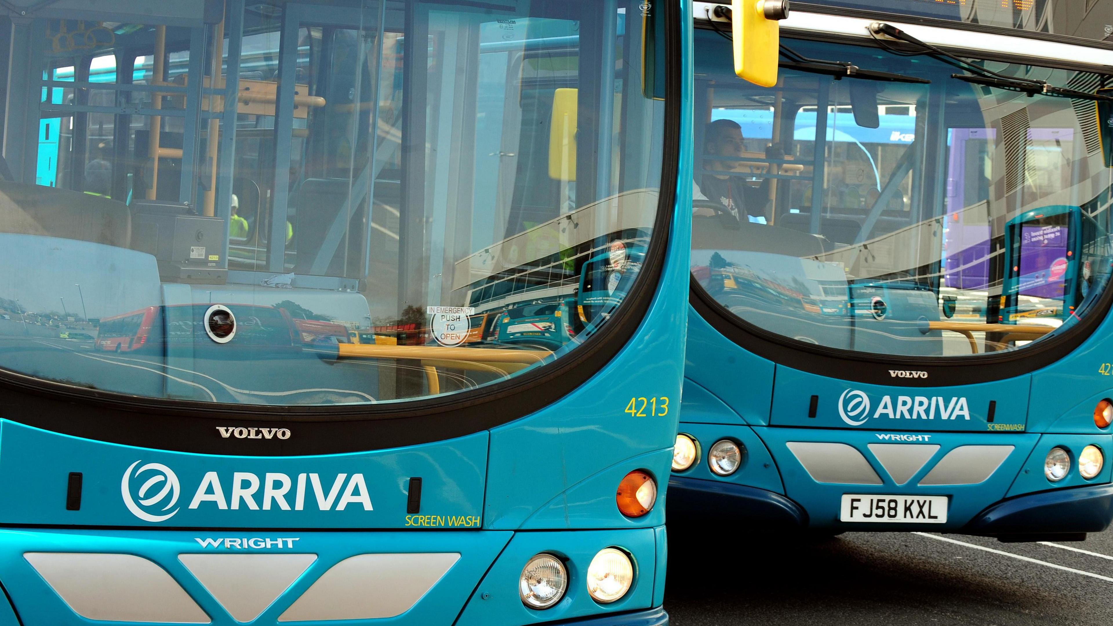 An image of two blue buses in Derby