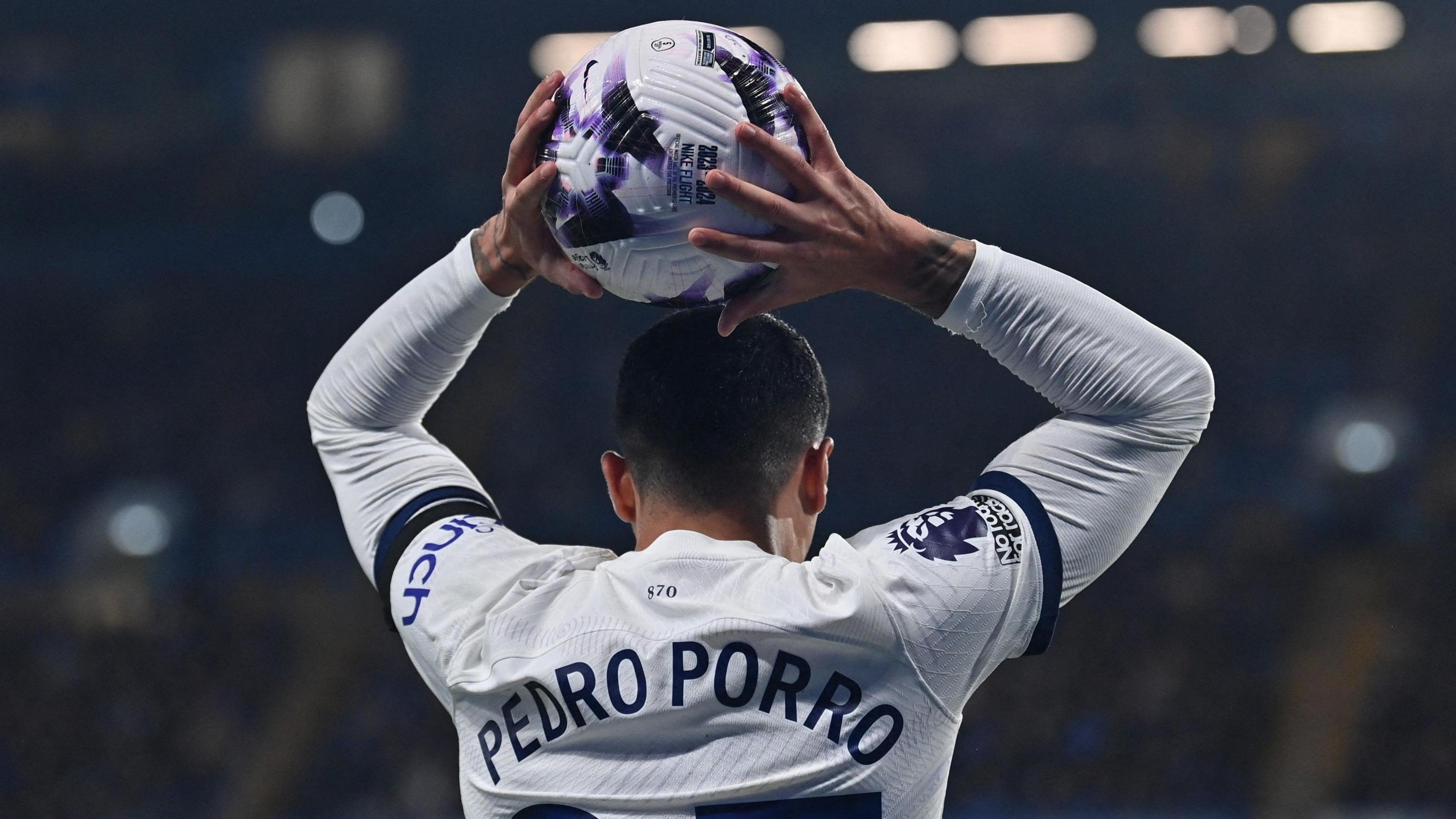 Pedro Porro takes a throw in