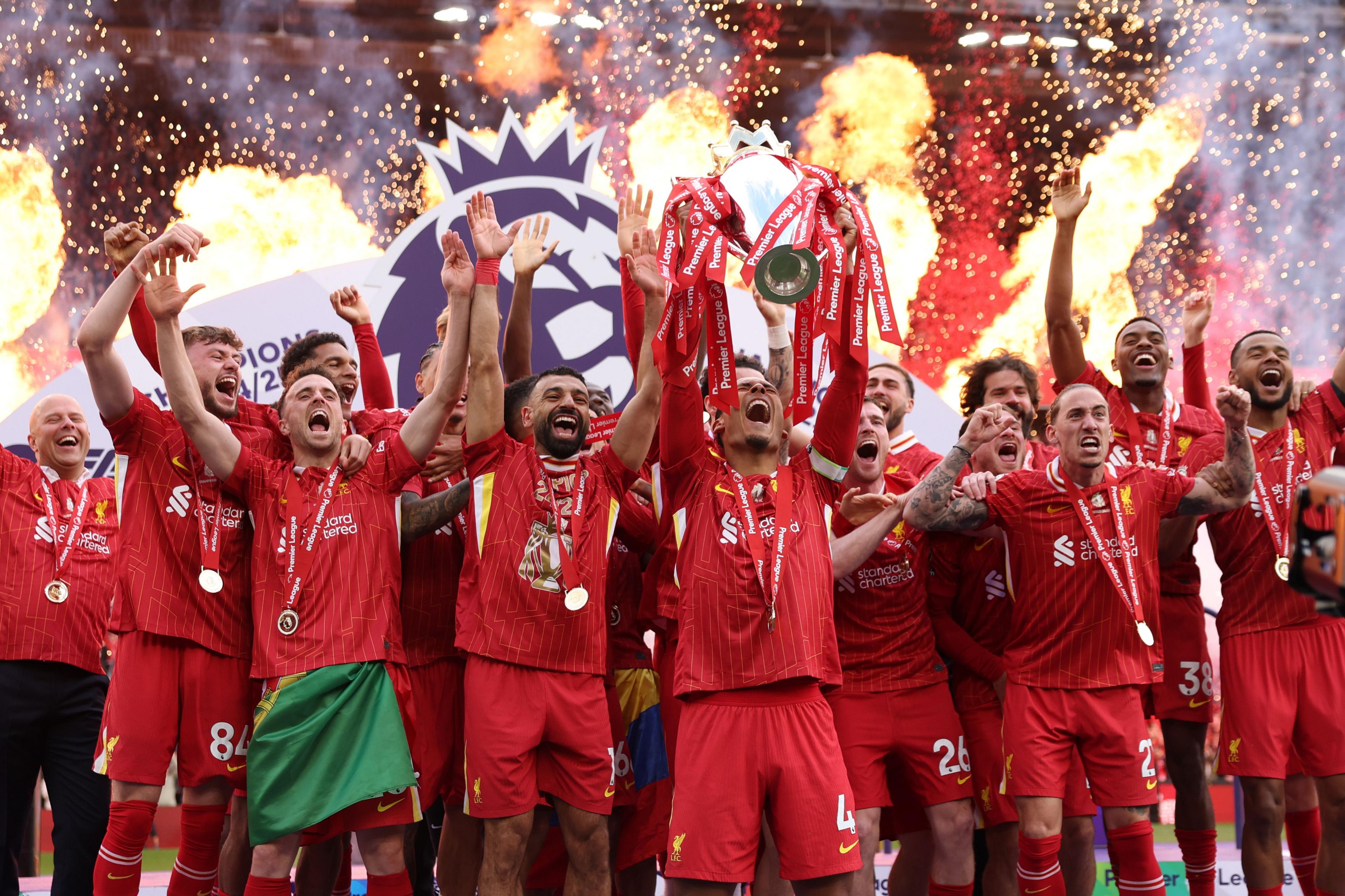 Liverpool's Virgil van Dijk lifts the Premier League trophy, as Liverpool are crowned the Champions of the Premier League for the 2024/25 Season, following the Premier League match between Liverpool and Crystal Palace at Anfield in Liverpool, England. Photo by Carl Recine