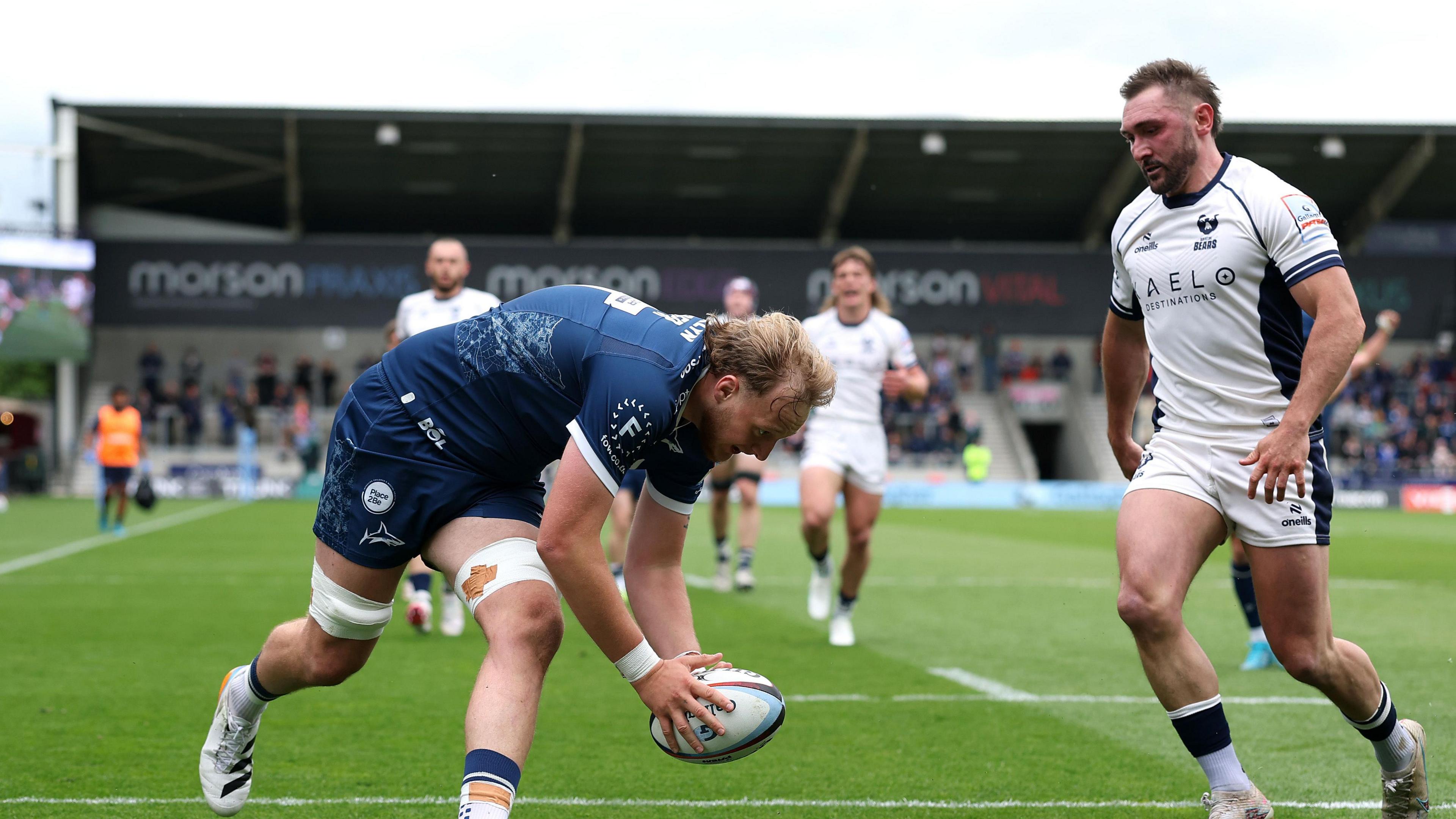 Sale second row Ben Bamber about to put the ball down for his side's second try with Bristol full-back Rich Lane watching on