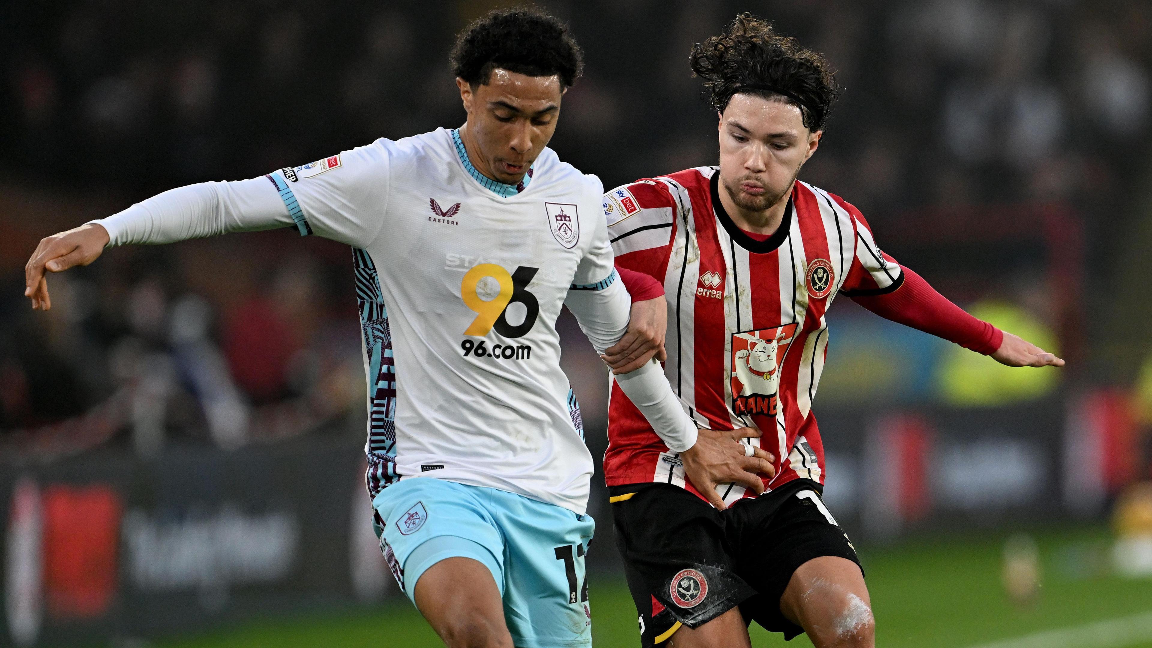 Burnley defender Bashir Humphreys holds off the challenge of Sheffield United's Callum O'Hare