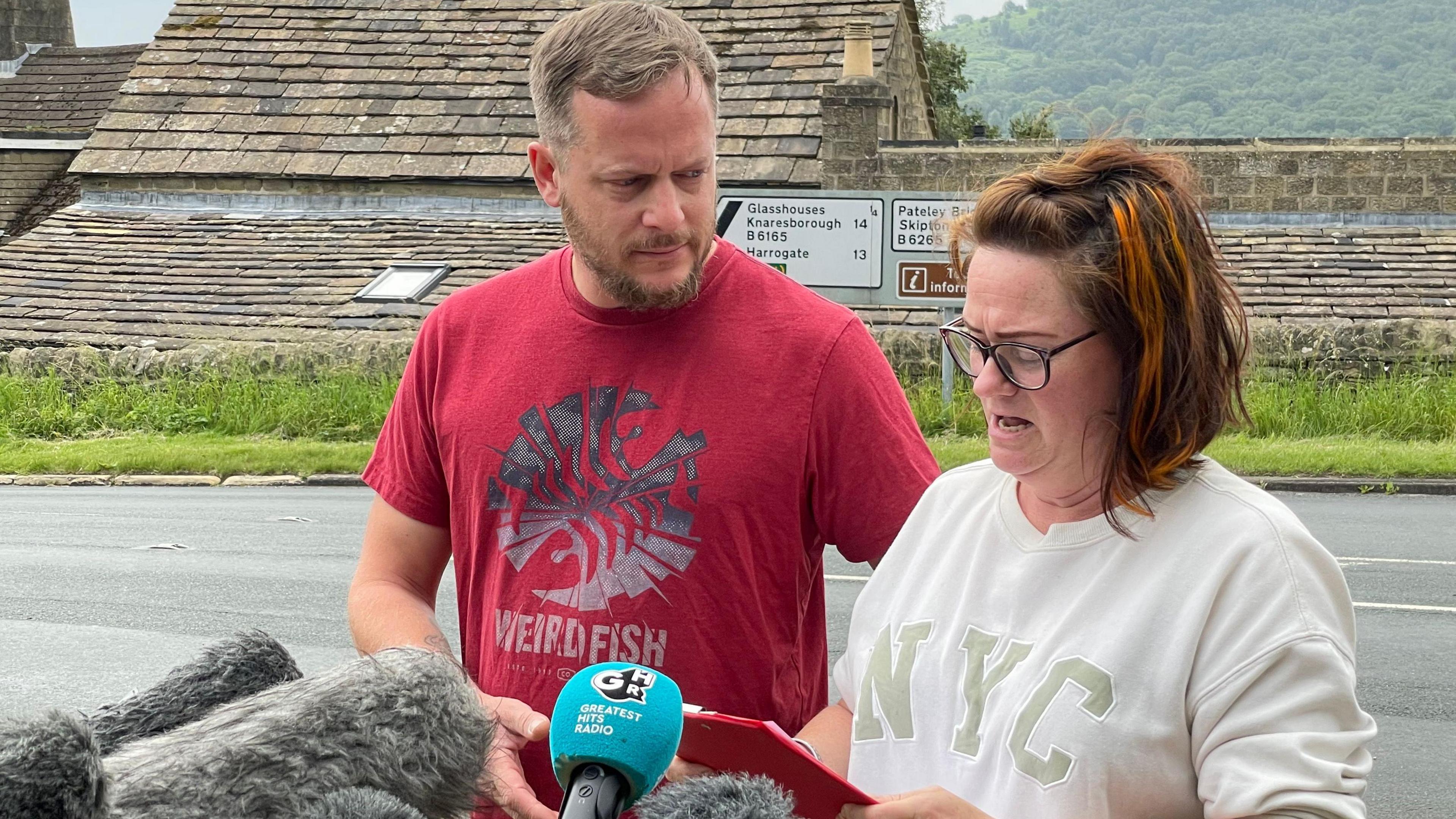Bailey's mum Dayle Knights and stepdad Daniel Horler stand next to each other and speak at a press conference.