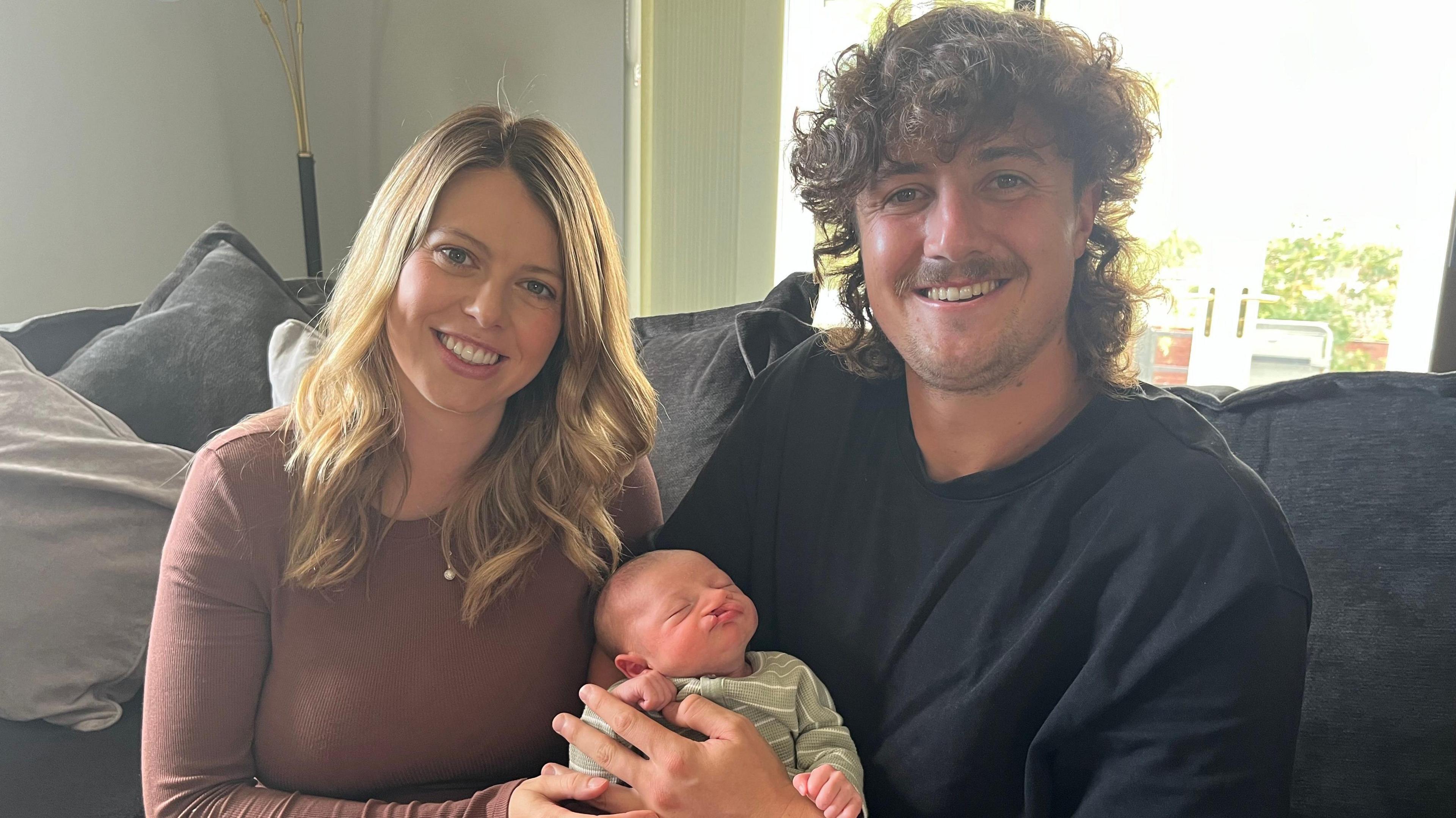Melissa Avison and Tom Kohler-Cadmore hold their baby son Dougie