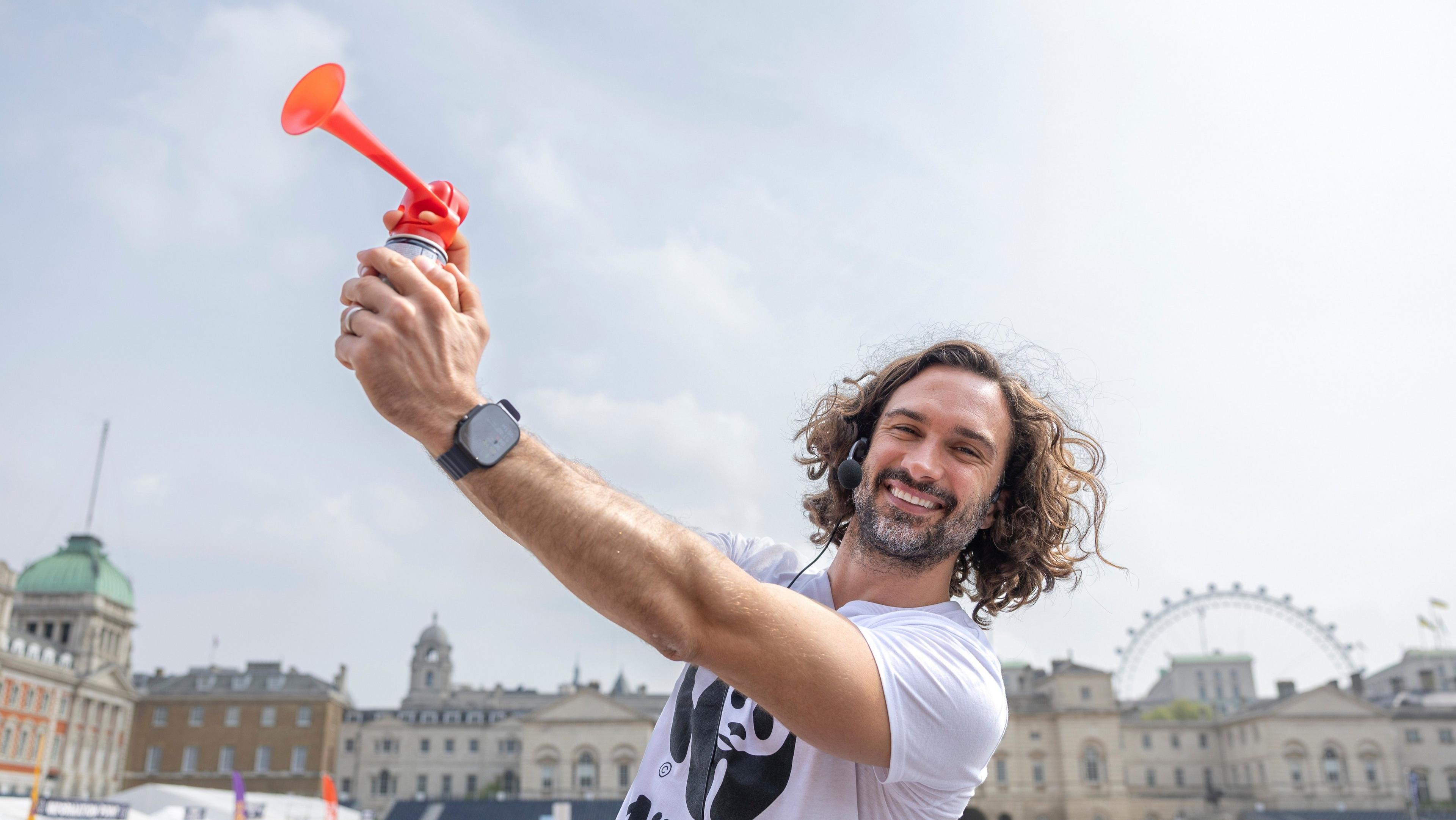 A photo of fitness influencer Joe Wicks holding an airhorn