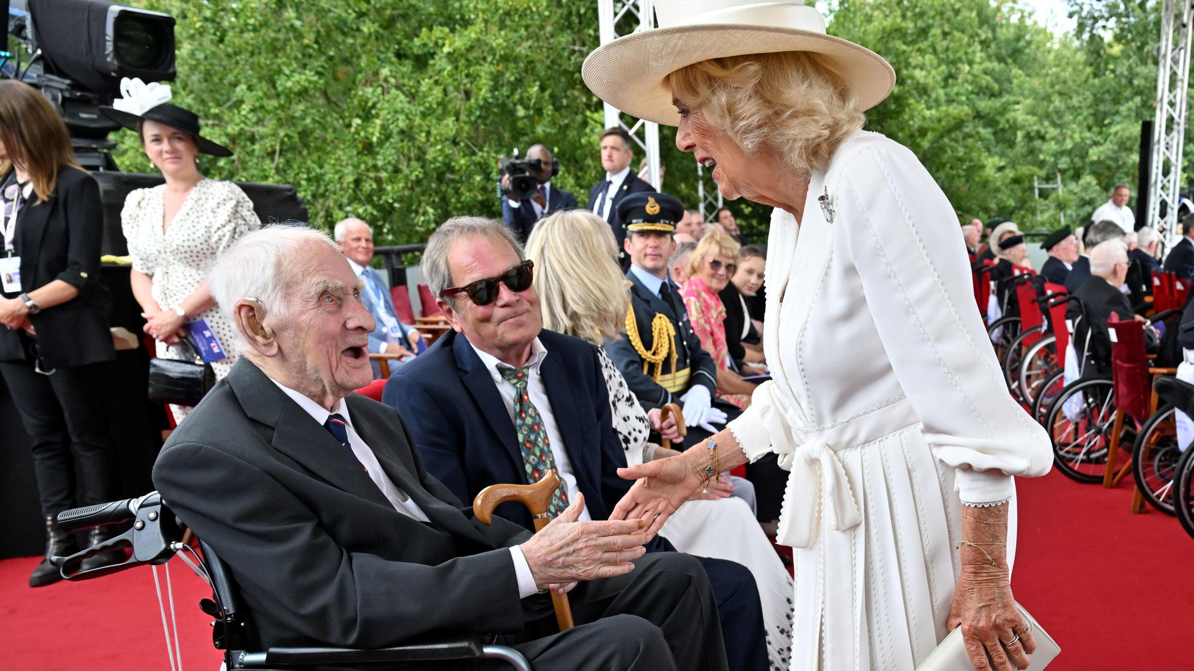 Queen Camilla greeting some of the veteran soldiers during the event