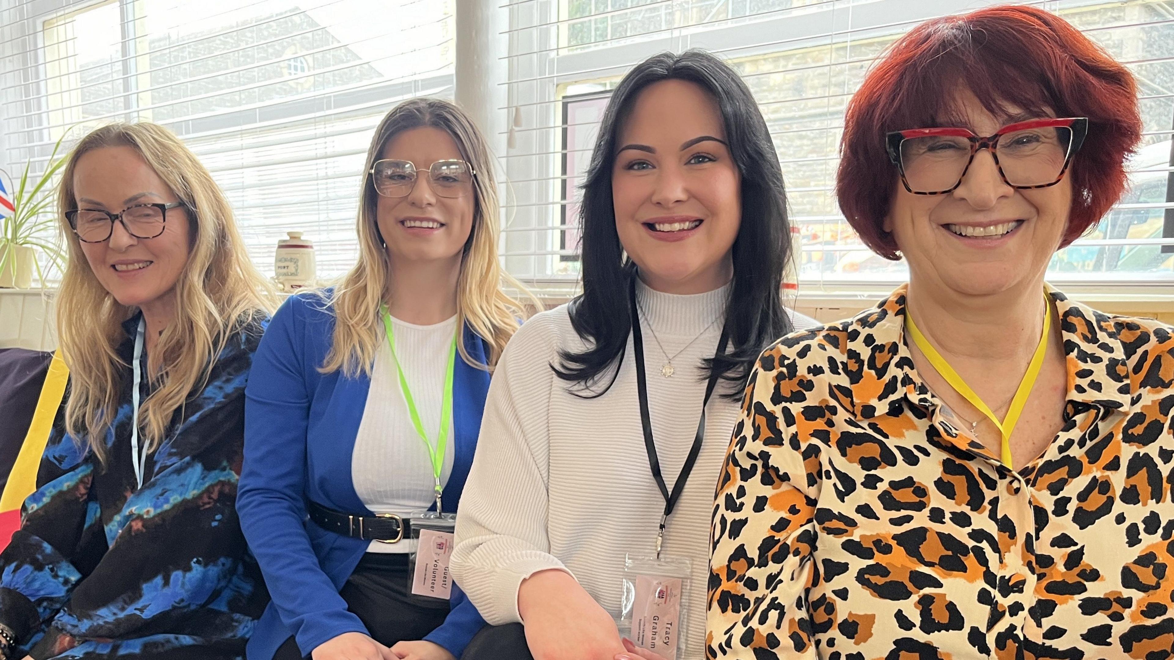 The "Better with Music" cafe team (left-right) Luiza Moir, Amanda Oakes, Tracy Graham and Amanda Mathieson sat side by side smiling