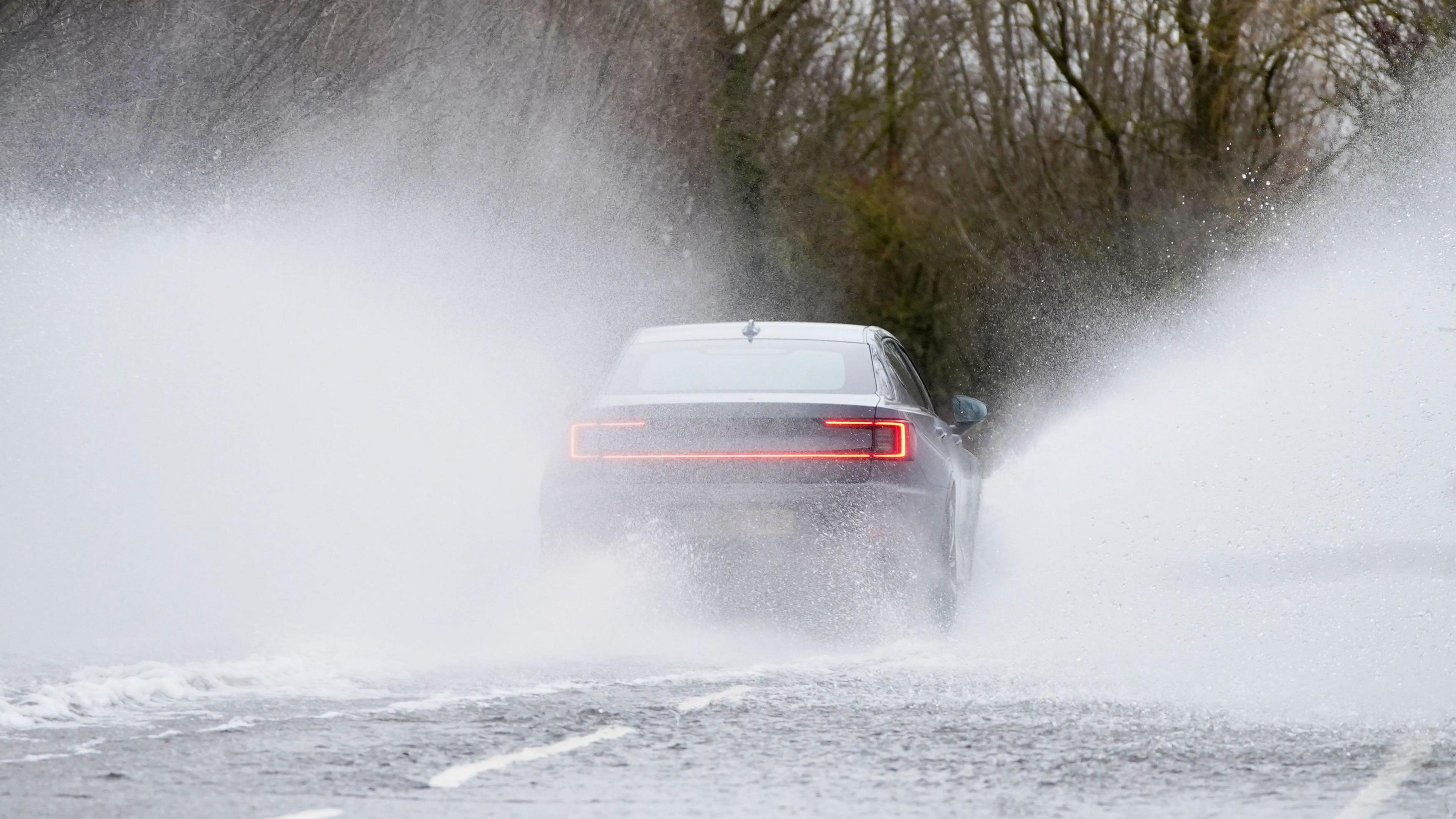 Car driving through flood water