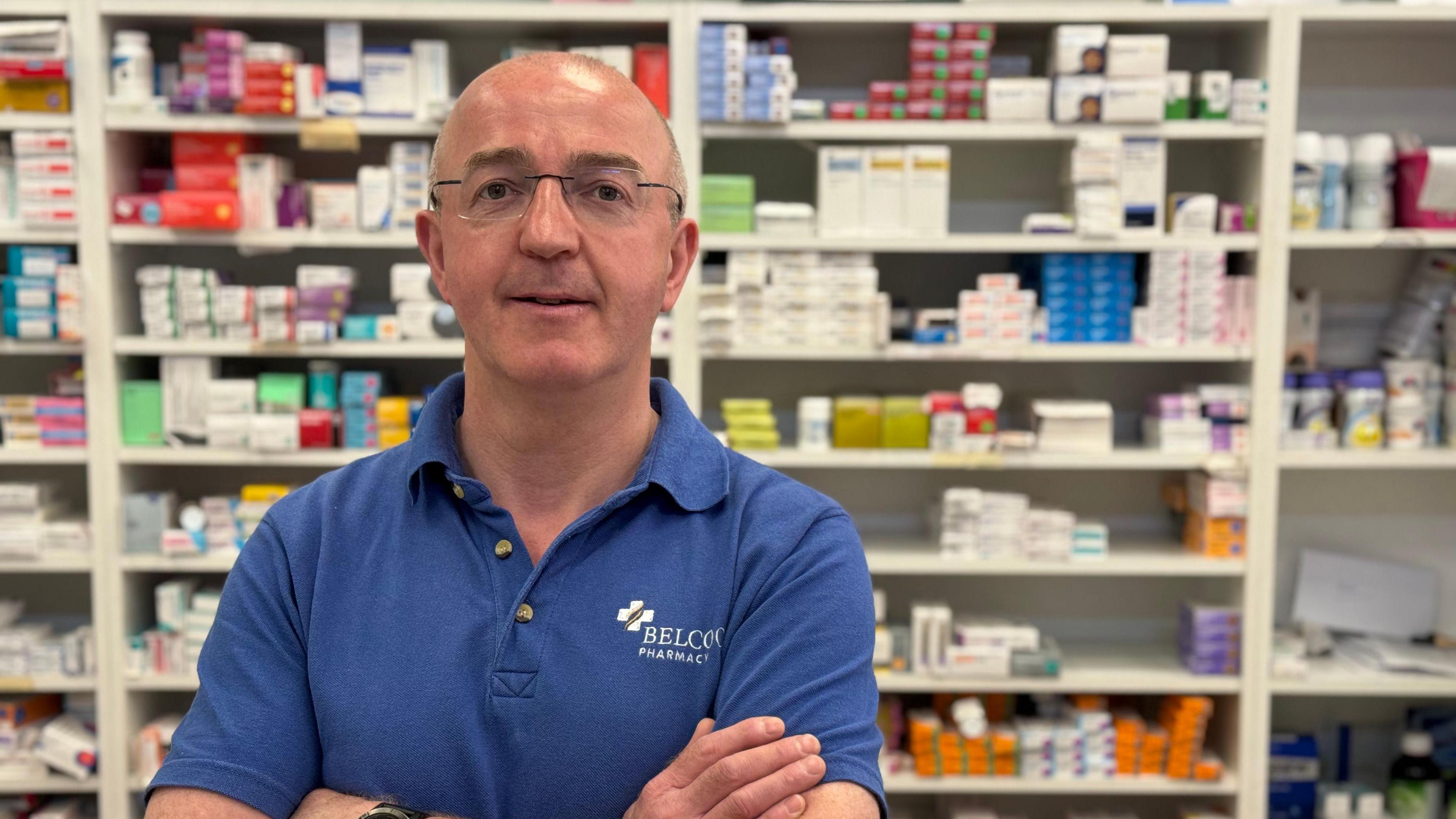 Joe McAleer standing in a pharmacy