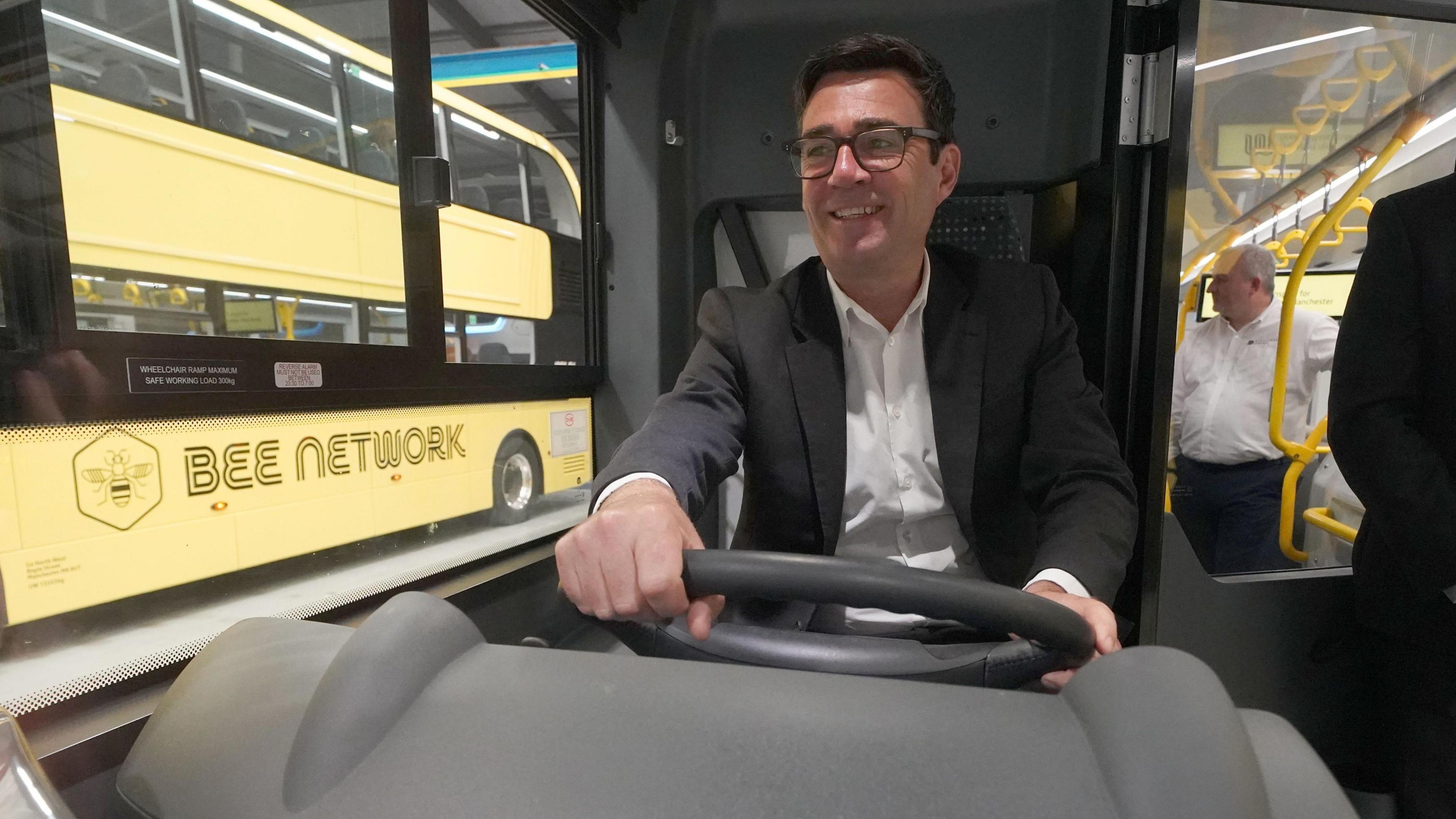 Greater Manchester mayor Andy Burnham views the 'Bee Network' buses at manufacturer Alexander Dennis in Larbert, Falkirk.