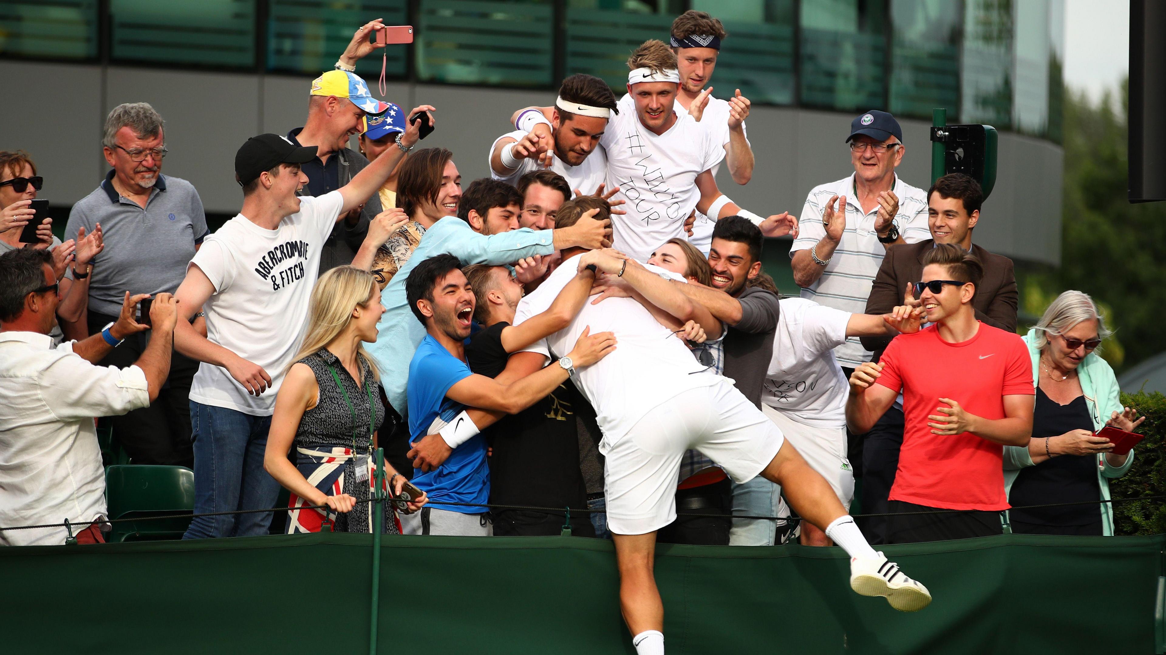 Marcus Willis celebrates with Wimbledon fans