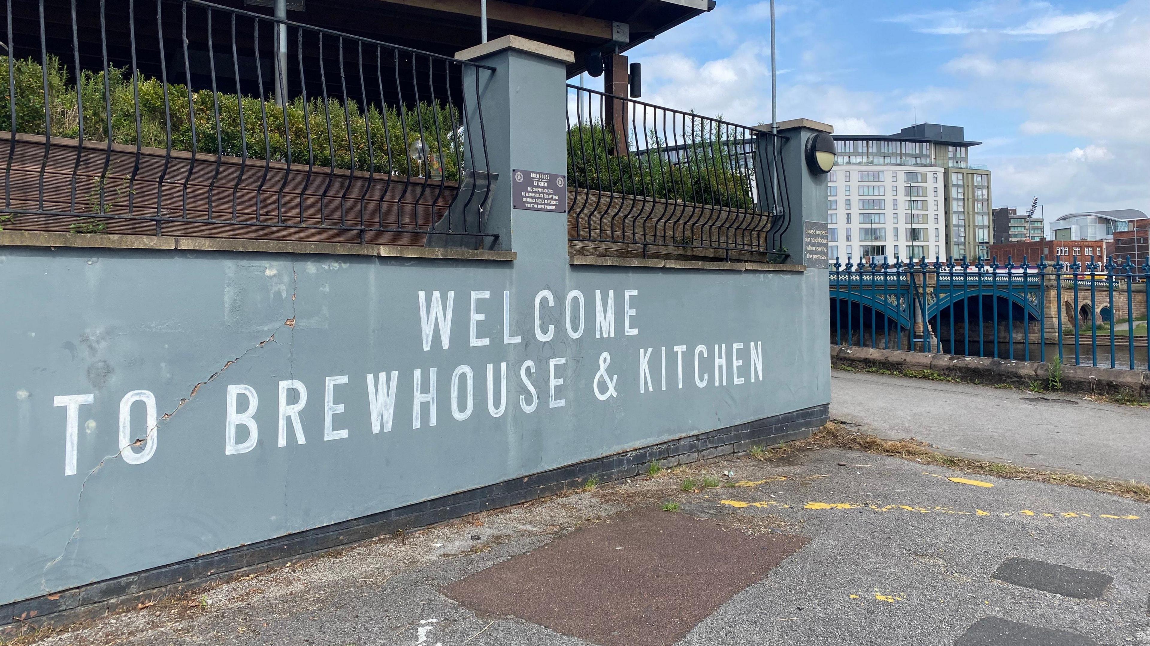 The exterior of a pub with its signs