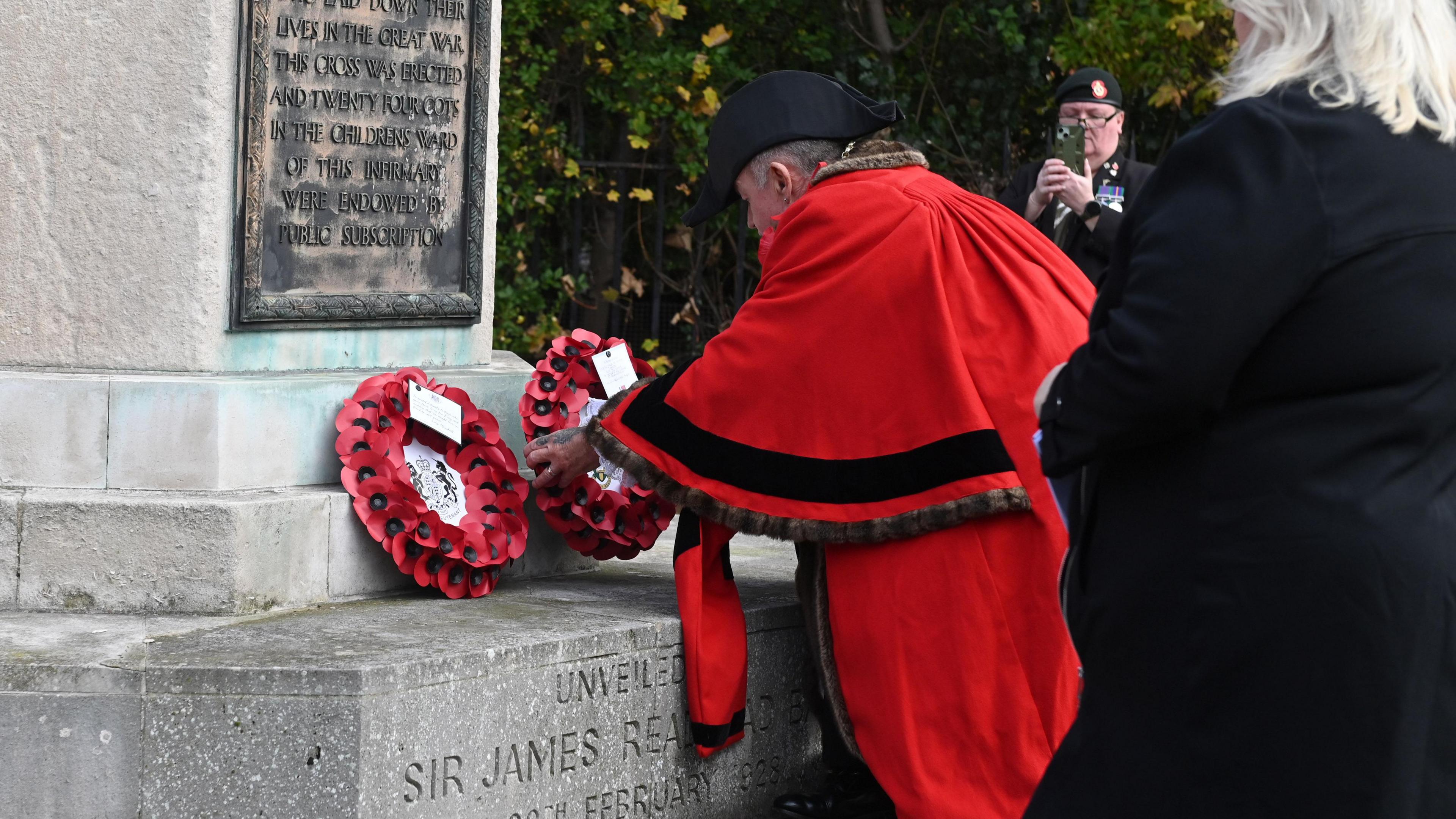 South Tyneside Mayor Jay Potts placing a red poppy wreath at the base of the war memorial in Westoe.