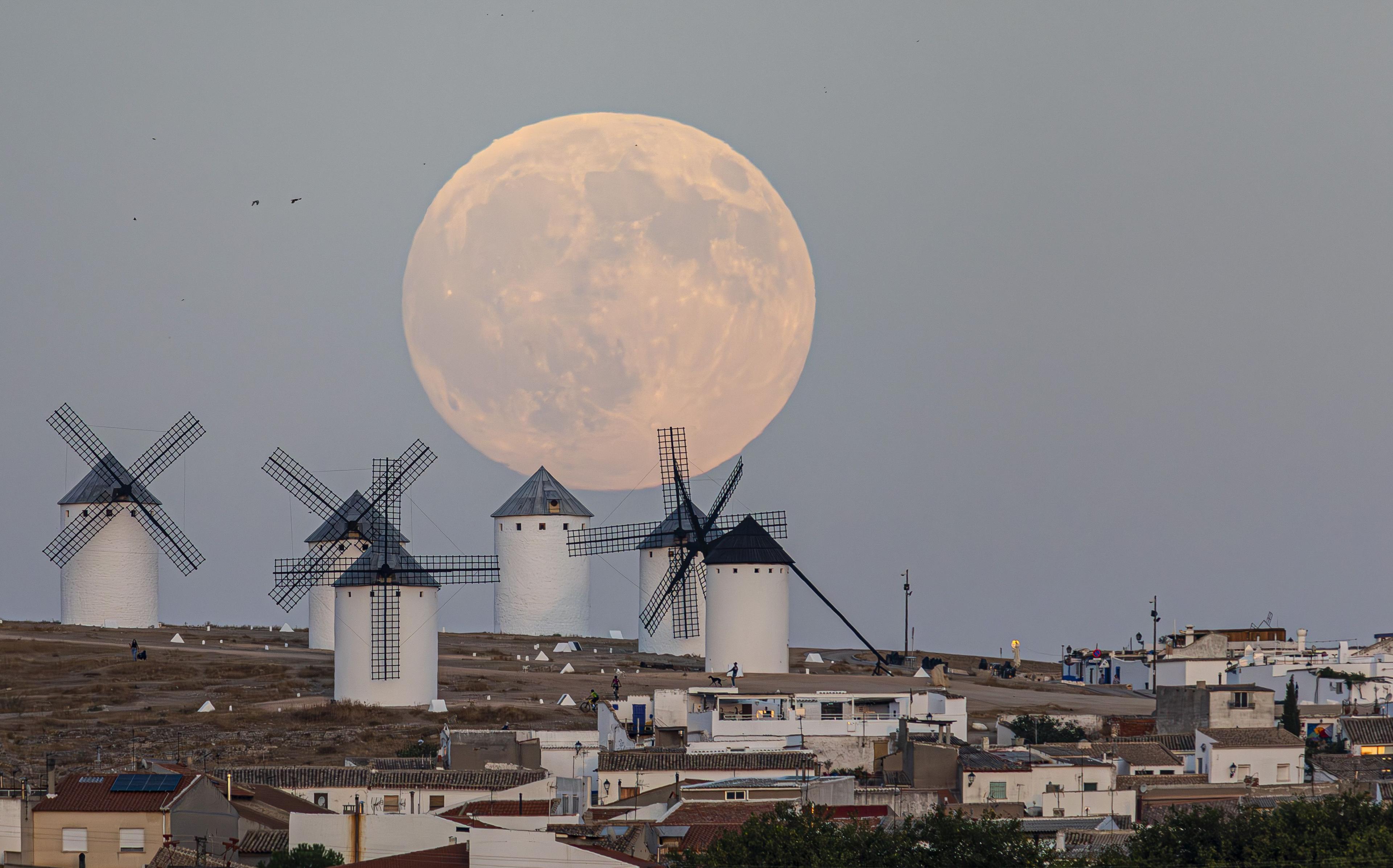 Windmills in front of the Moon