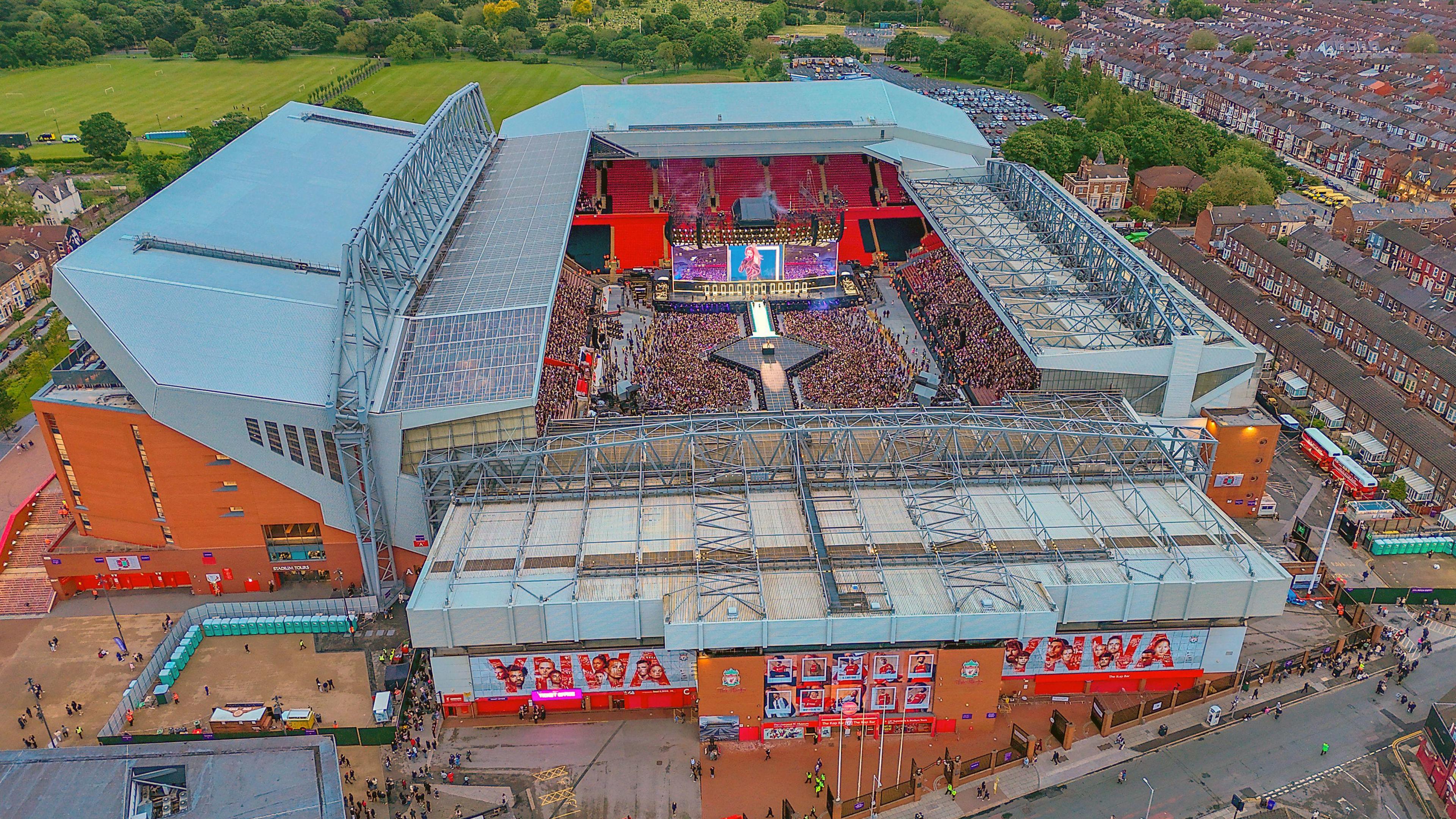 An aerial view of Anfield stadium in Liverpool showing crowds watching a Taylor Swift concert