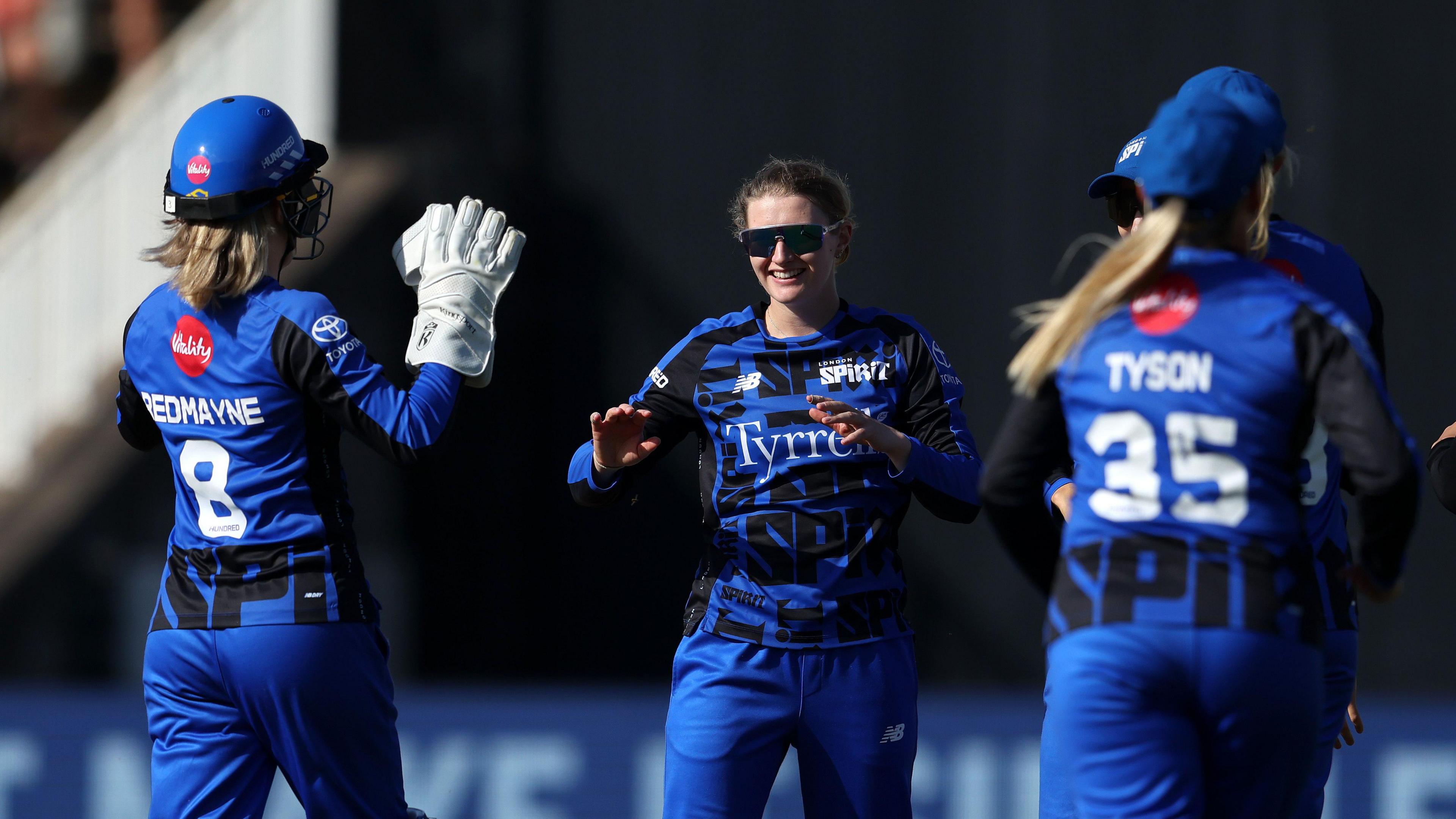 Charlie Dean celebrates a wicket with her London Spirit team-mates