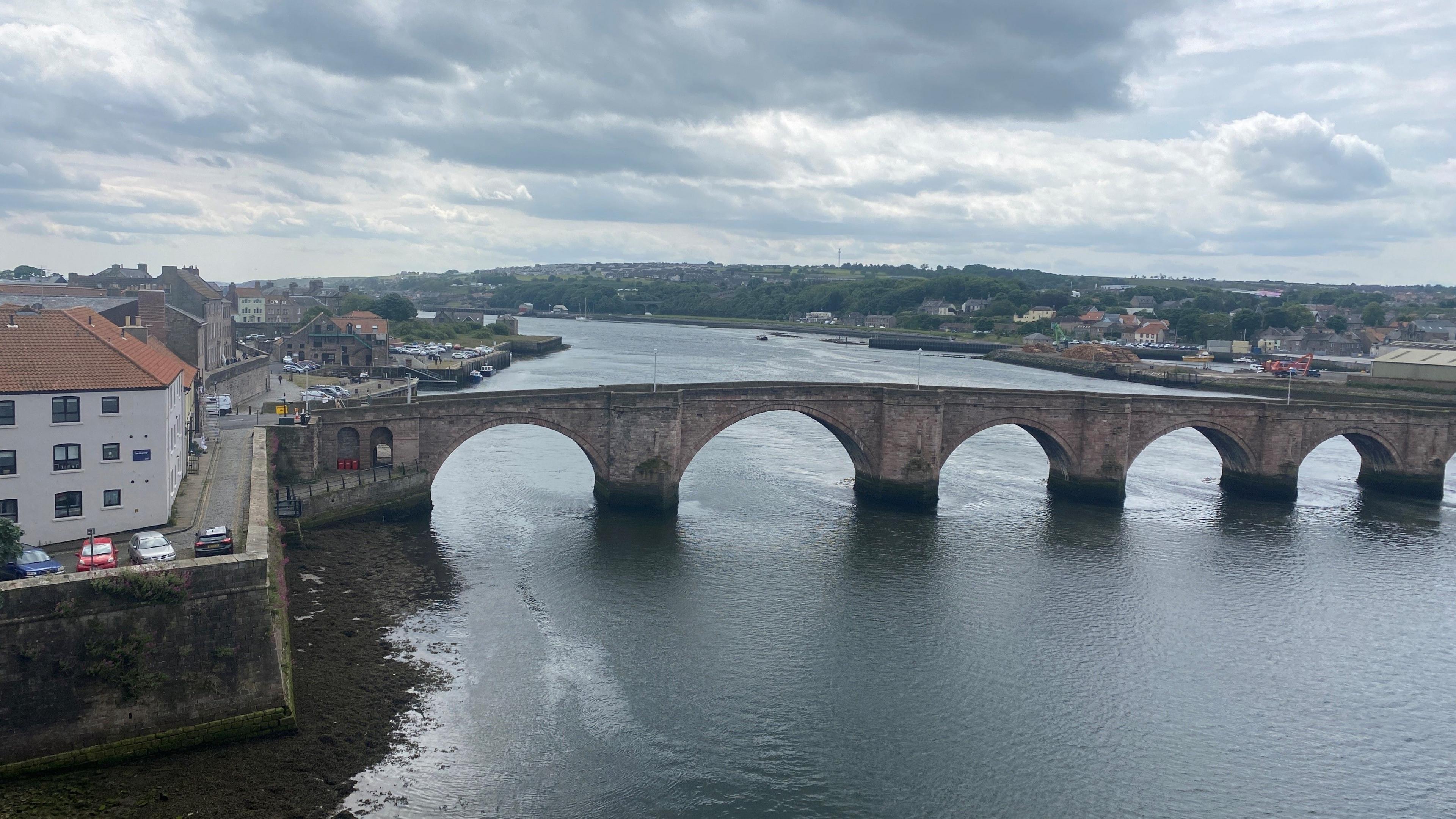 A picture of Berwick Bridge looking down the river tweed out to sea 