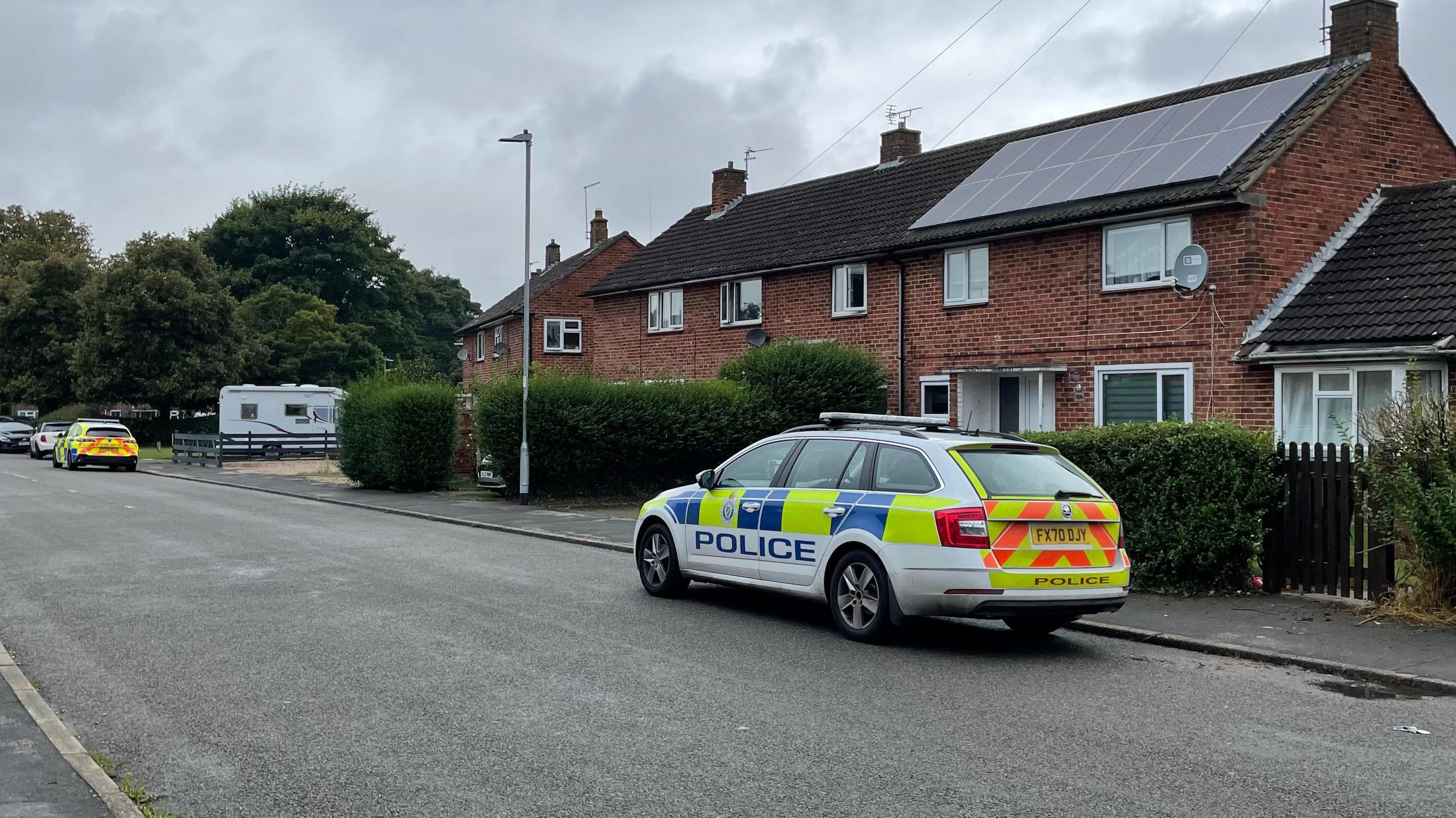 Picture of a police car outside a house in Queen Elizabeth Road, Lincoln