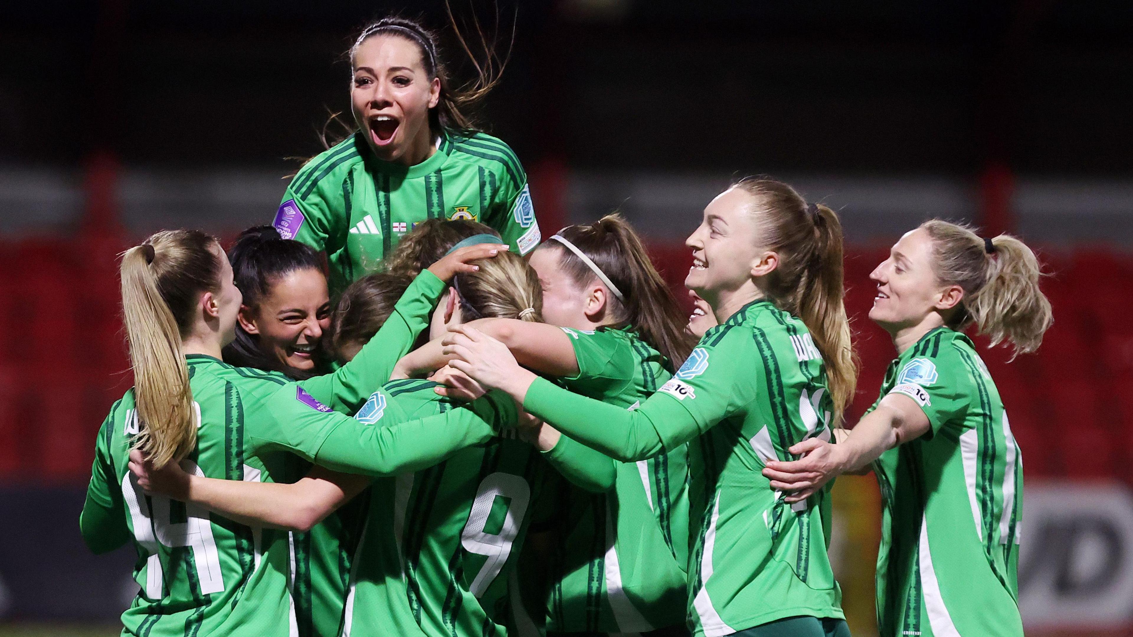 Northern Ireland players celebrate after scoring a goal