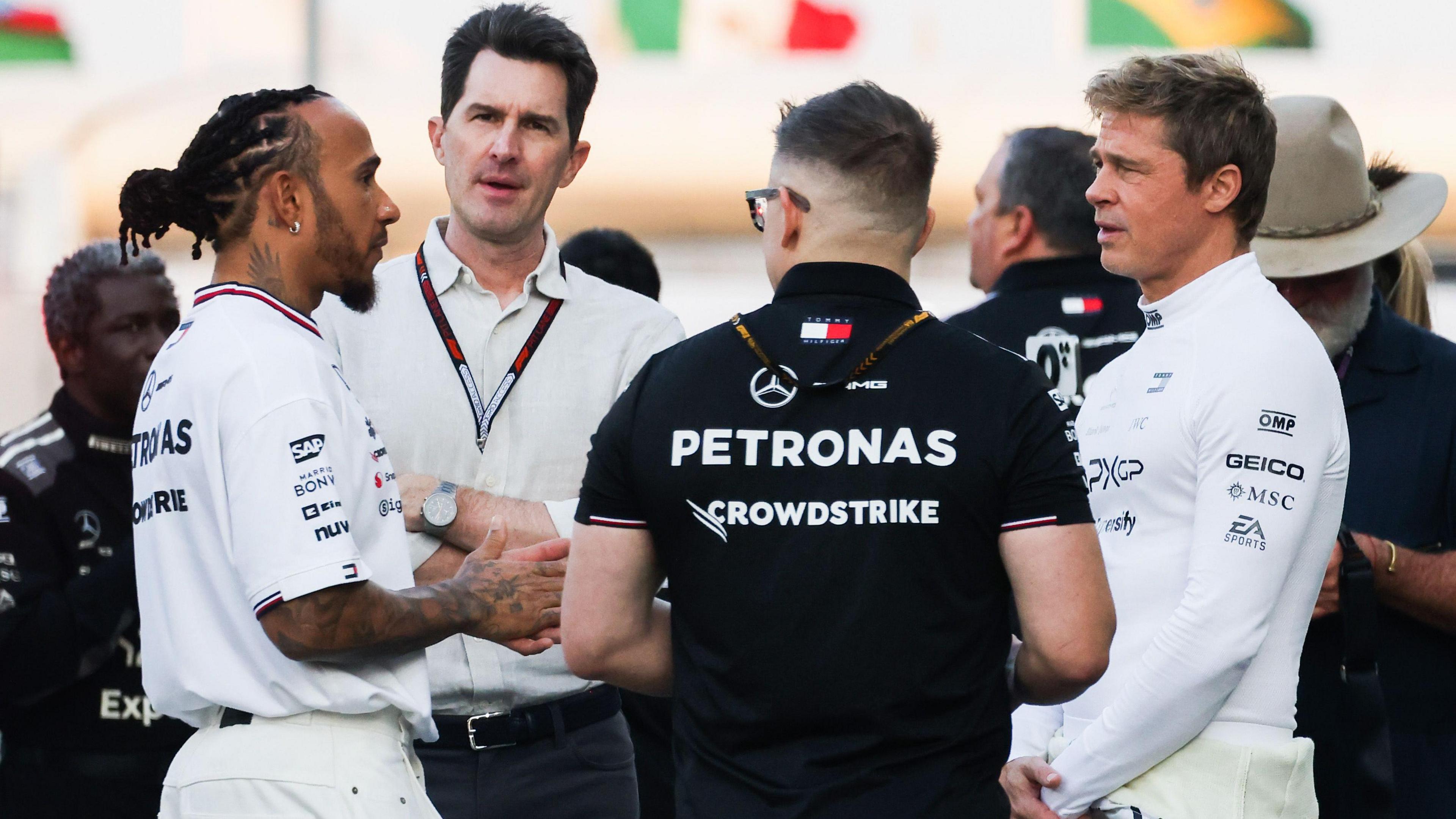 Lewis Hamilton chats to Brad Pitt at the 2024 Abu Dhabi Grand Prix