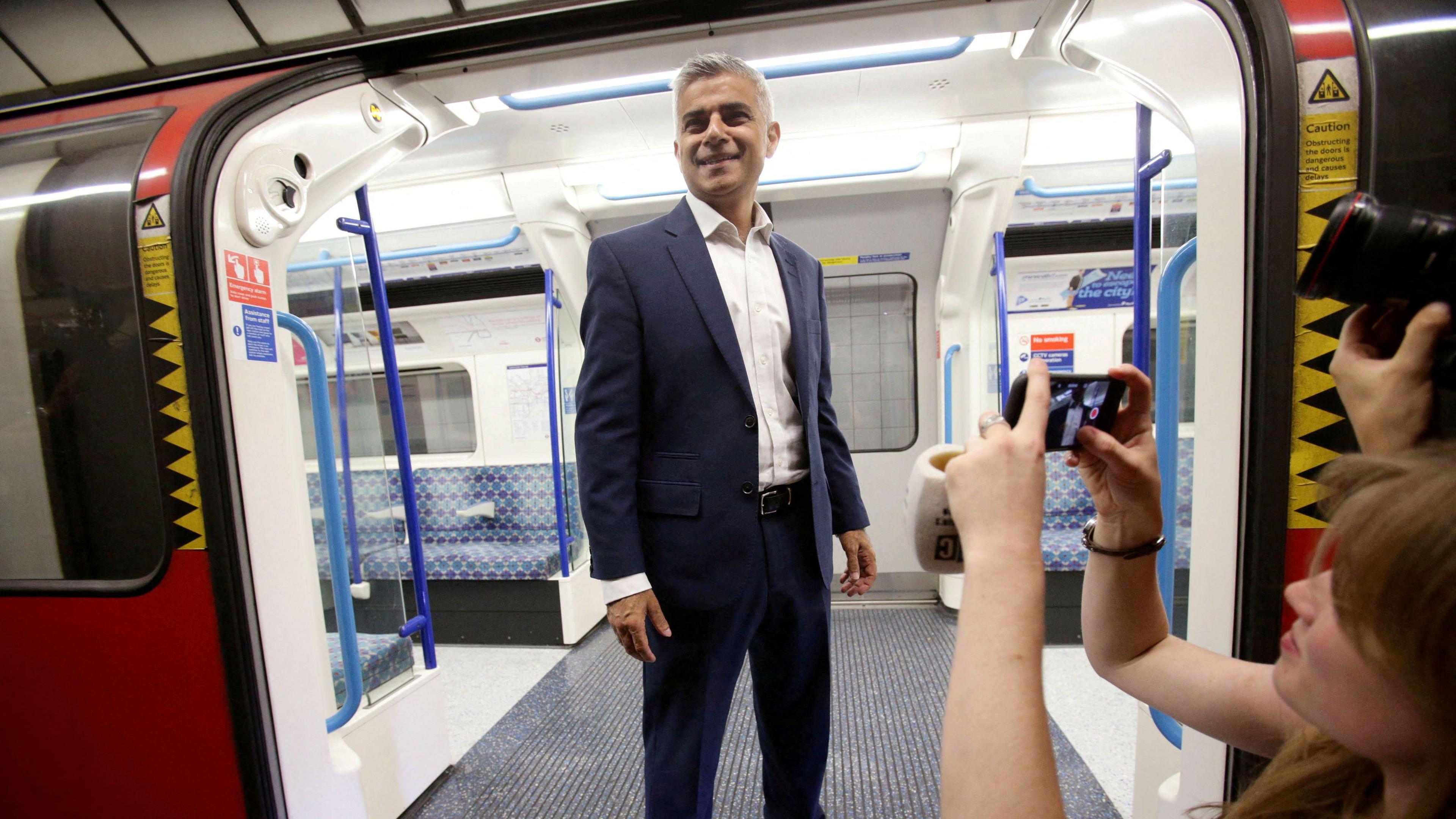 Mayor of London Sadiq Khan poses for the media on a Victoria line tube train carriage at Brixton Underground station, during the launch of London's Night Tube in 2016