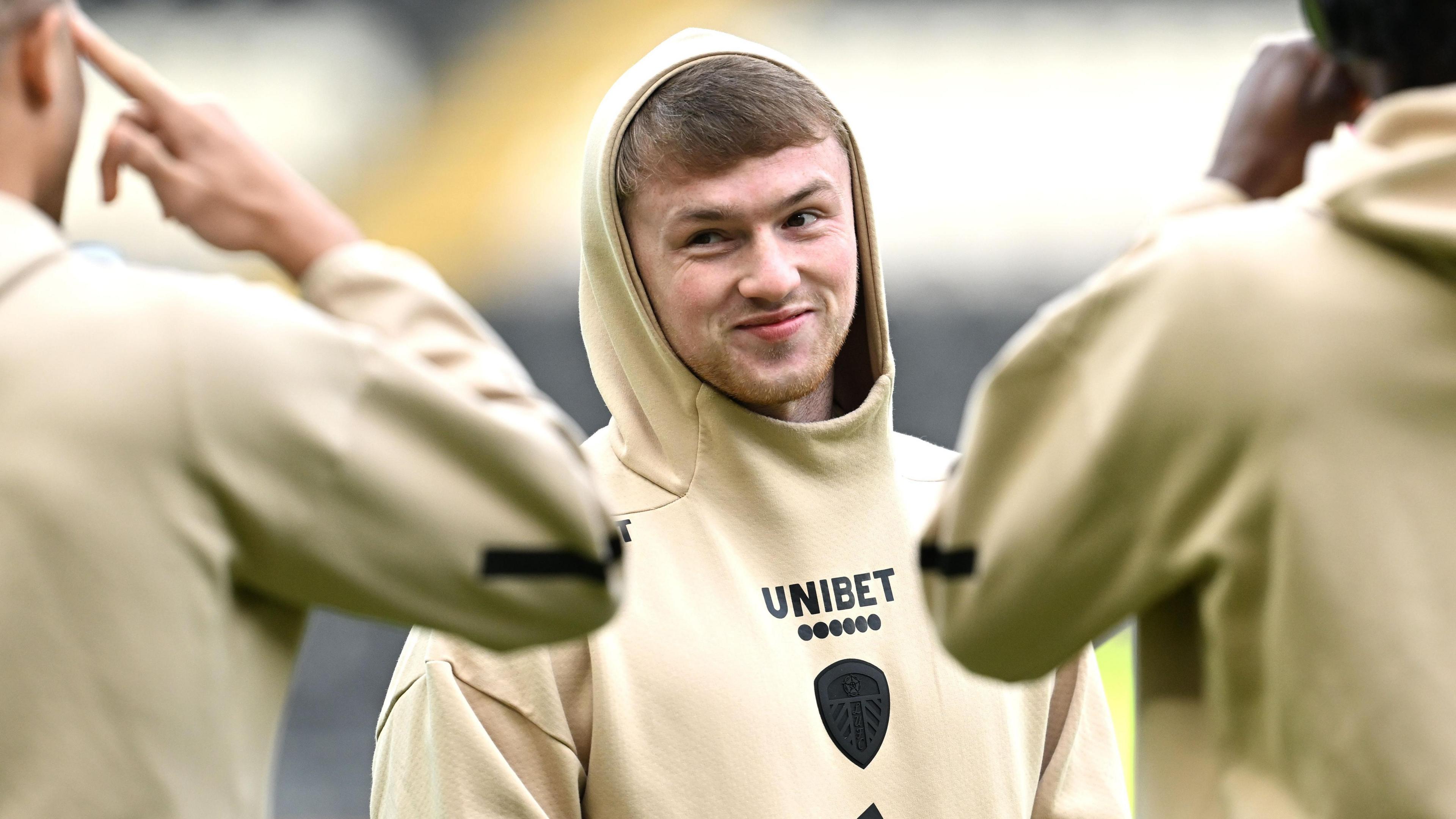 Joe Gelhardt pictured wearing a Leeds United hoodie before a game