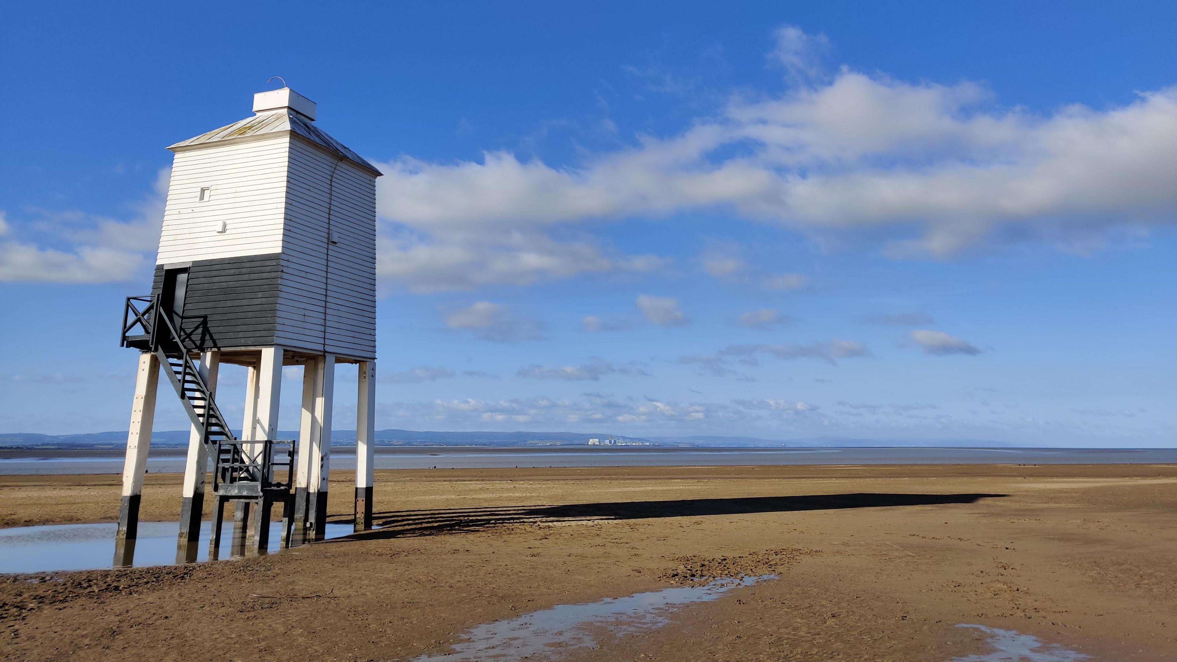 The beach at Burnham with blue skies behind
