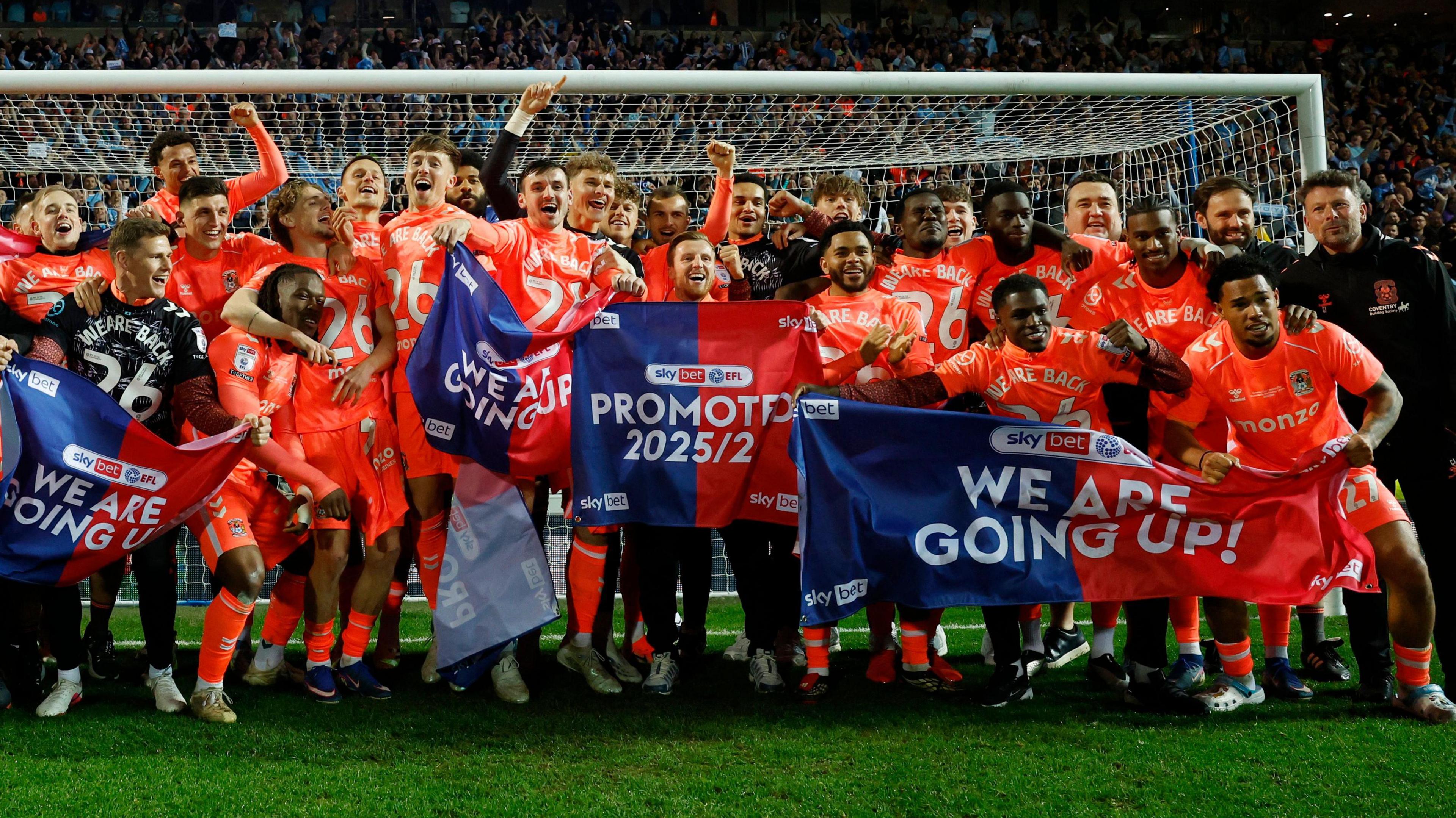 Coventry City players celebrate promotion to the Premier League at Blackburn Rovers