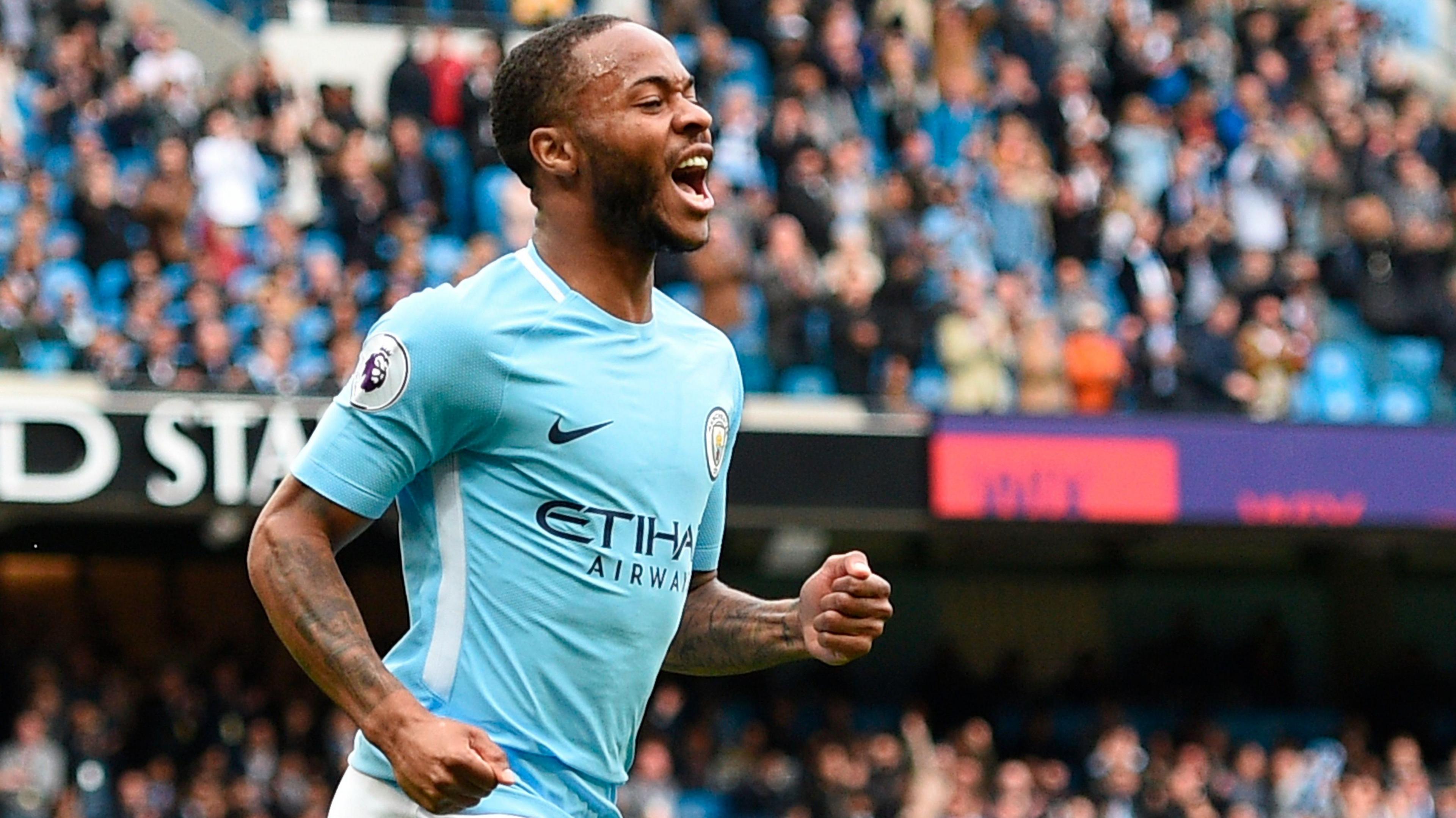Manchester City's English midfielder Raheem Sterling celebrates scoring their second goal during the English Premier League football match between Manchester City and Swansea at the Etihad Stadium in Manchester, north west England, on April 22, 2018. 