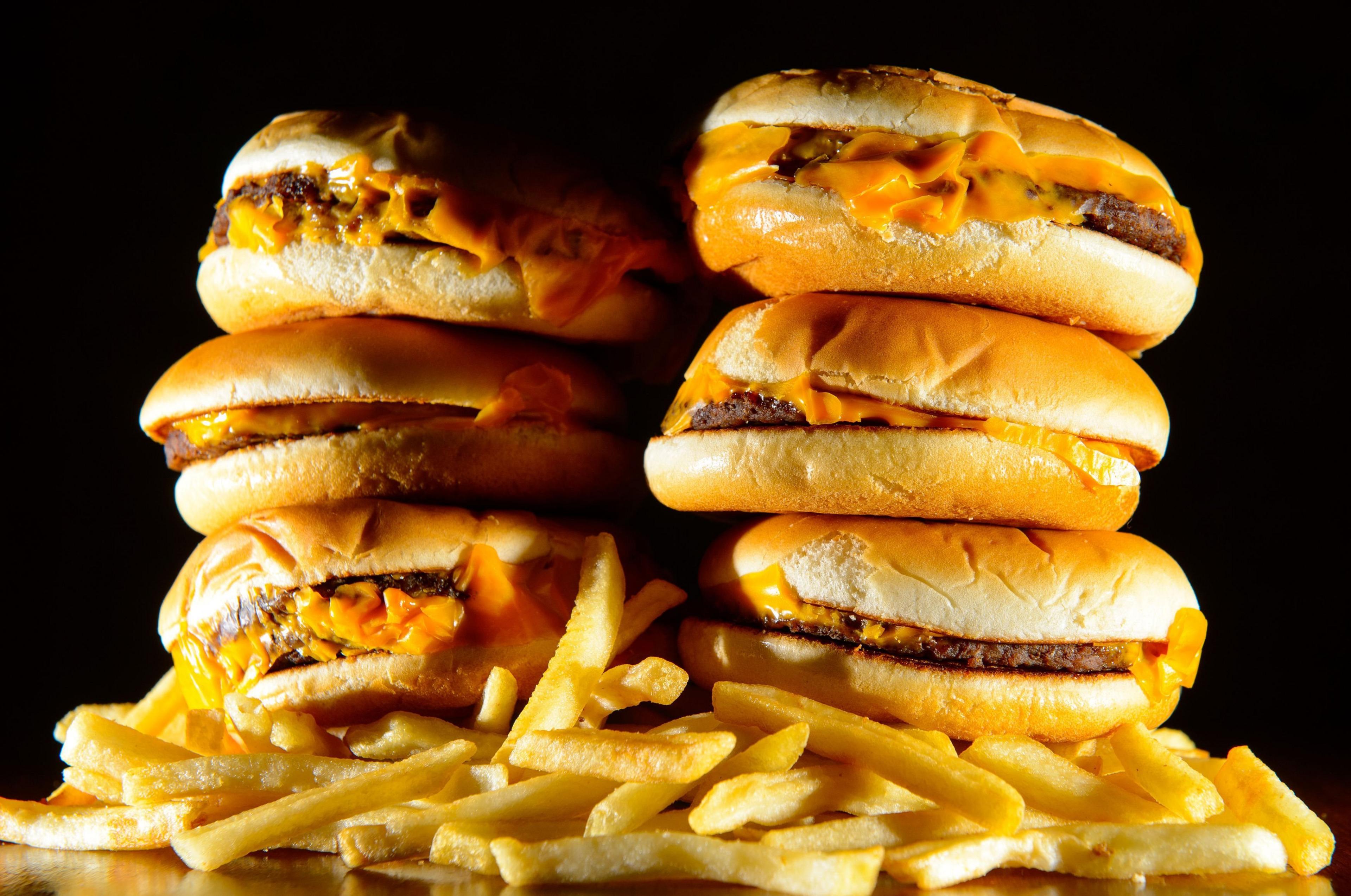 File photo dated 09/07/14 of a pile of cheeseburgers and french fries