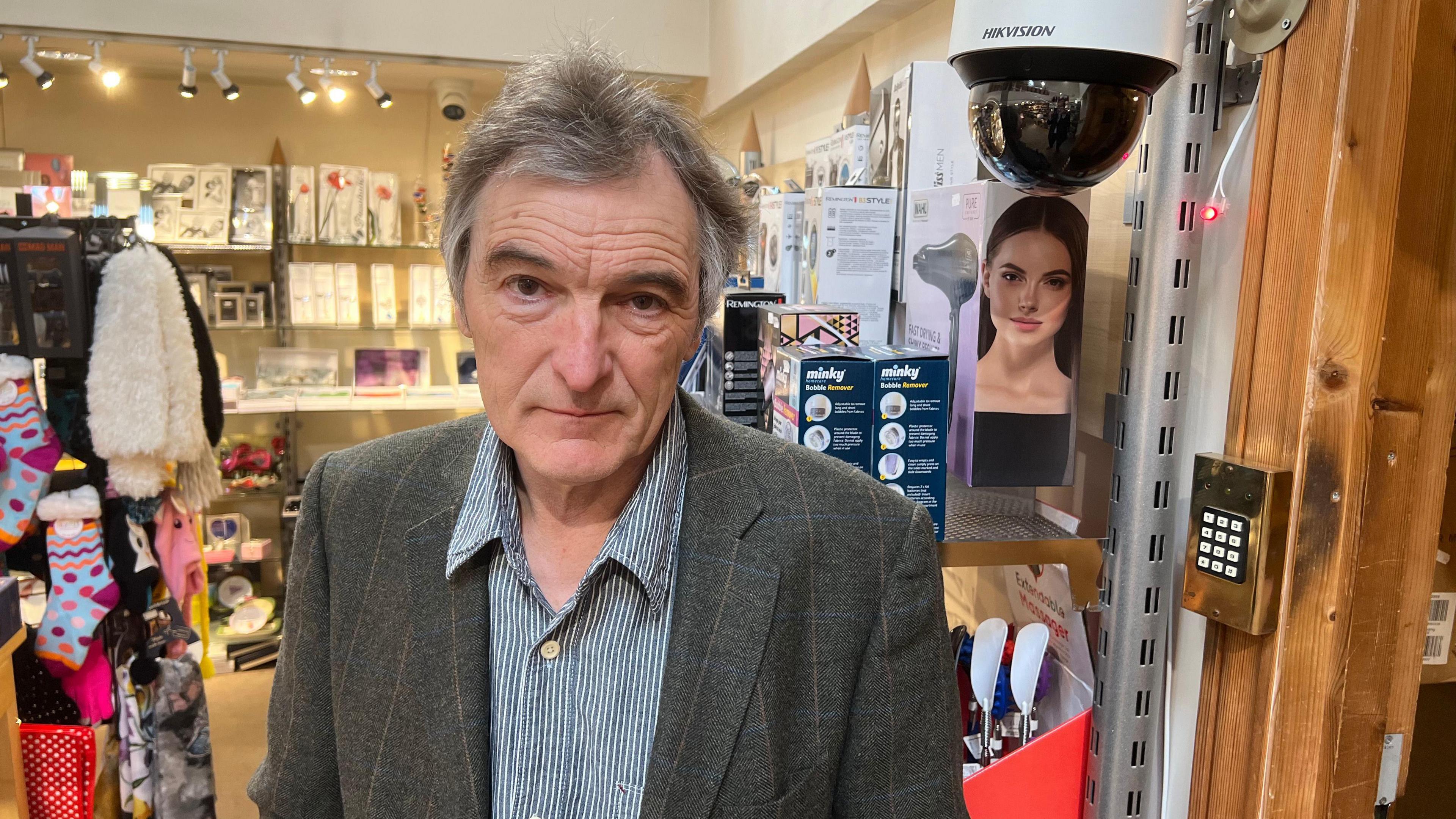 A man stands in a shop