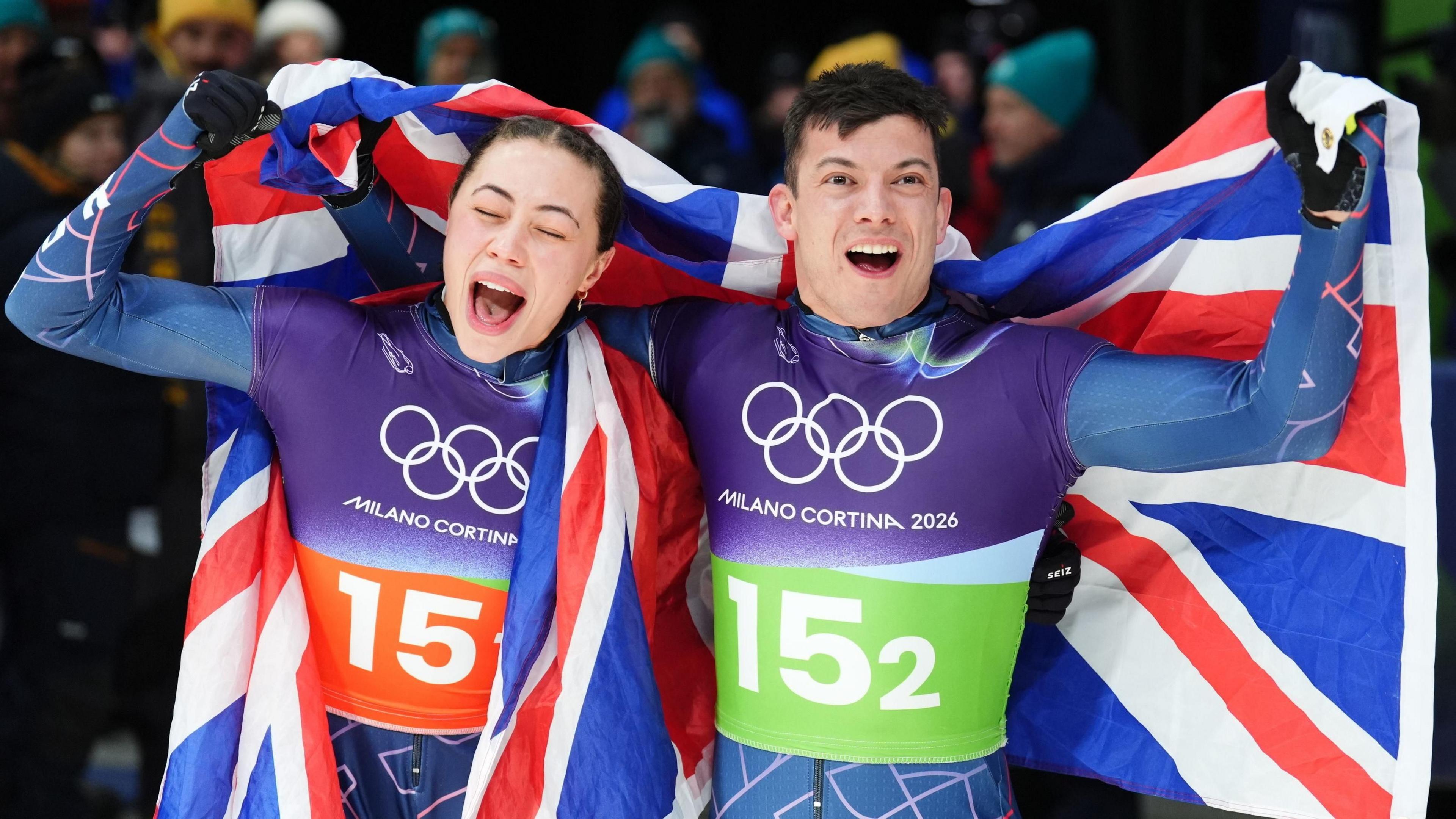 Matt Weston and Tabitha Stoecker celebrate winning gold after the Skeleton Mixed Team FinaL