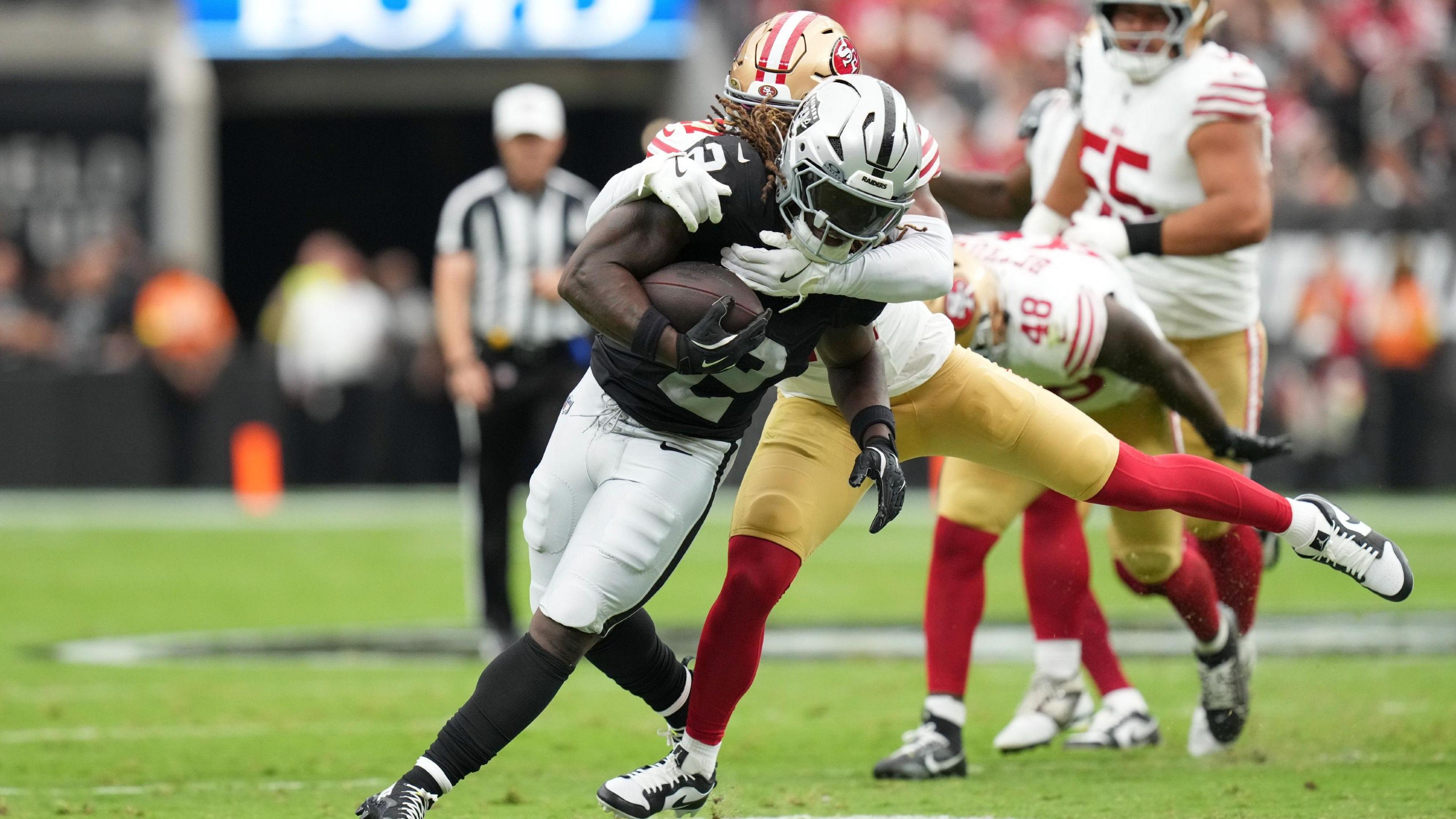 Ashton Jeanty tackled by the San Francisco 49ers