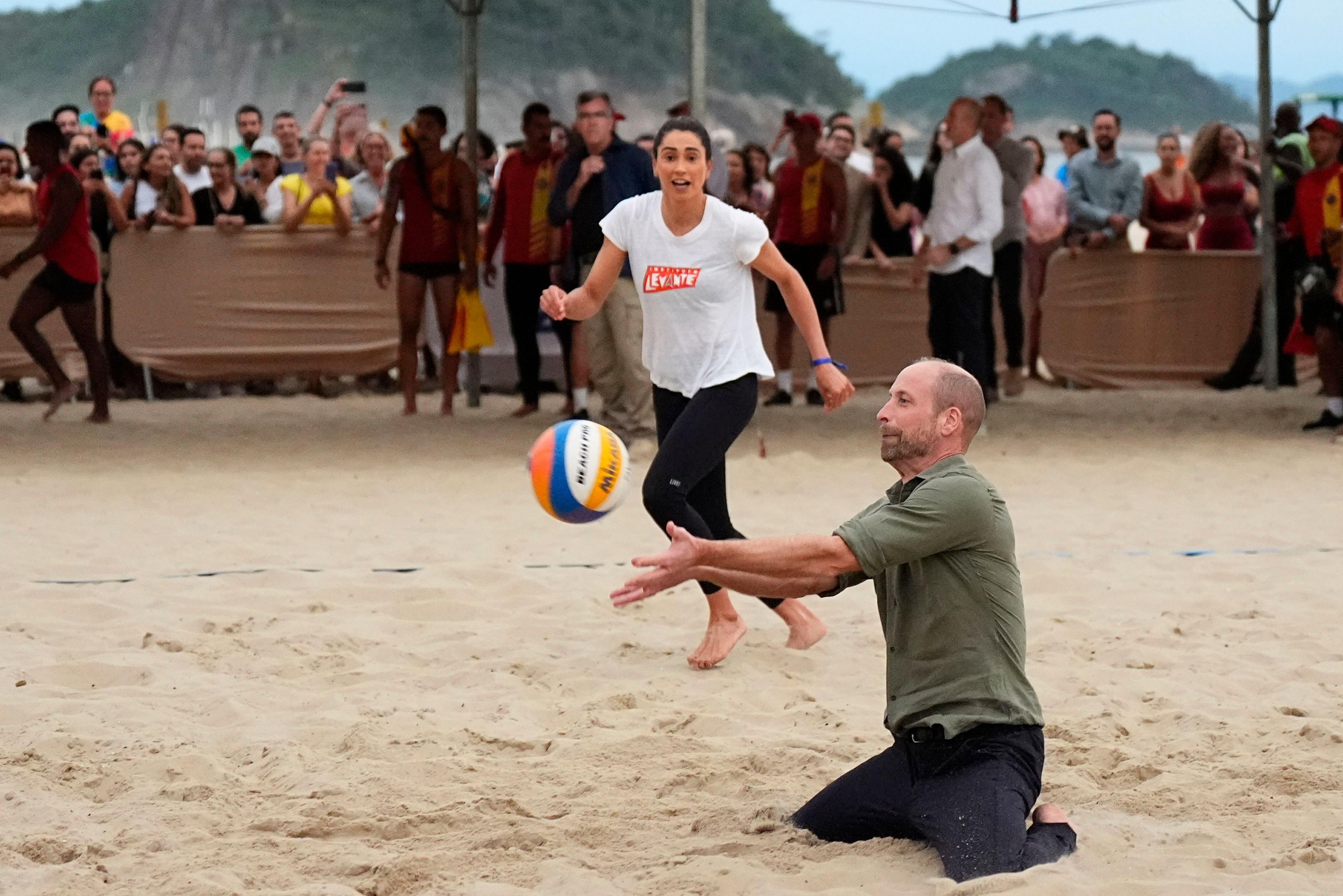 Prince William playing volleyball on his trip to Brazil.