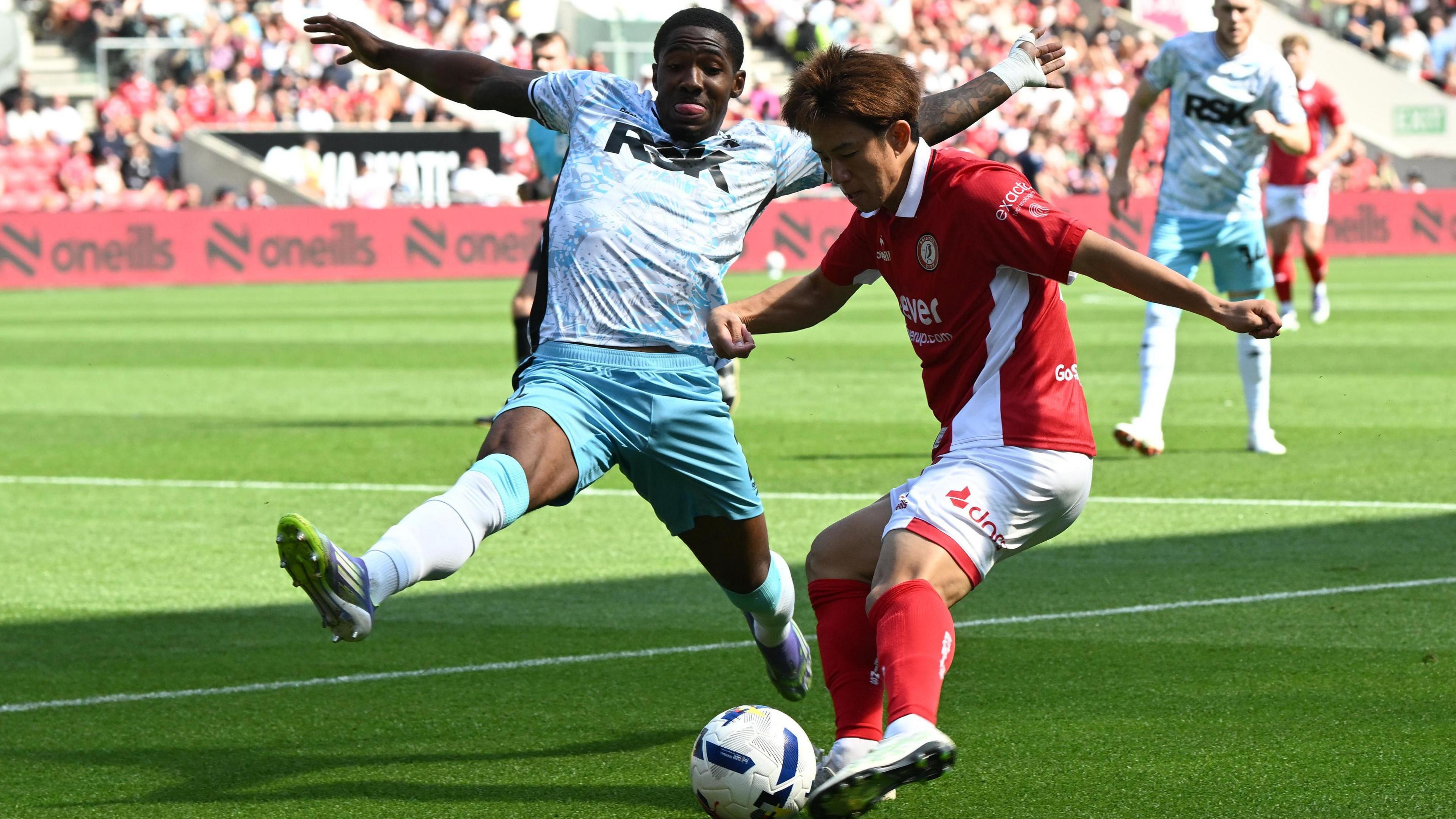Yu Hirakawa (7) of Bristol City on the attack battles for possession with Kayne Ramsay (2) of Charlton Athletic