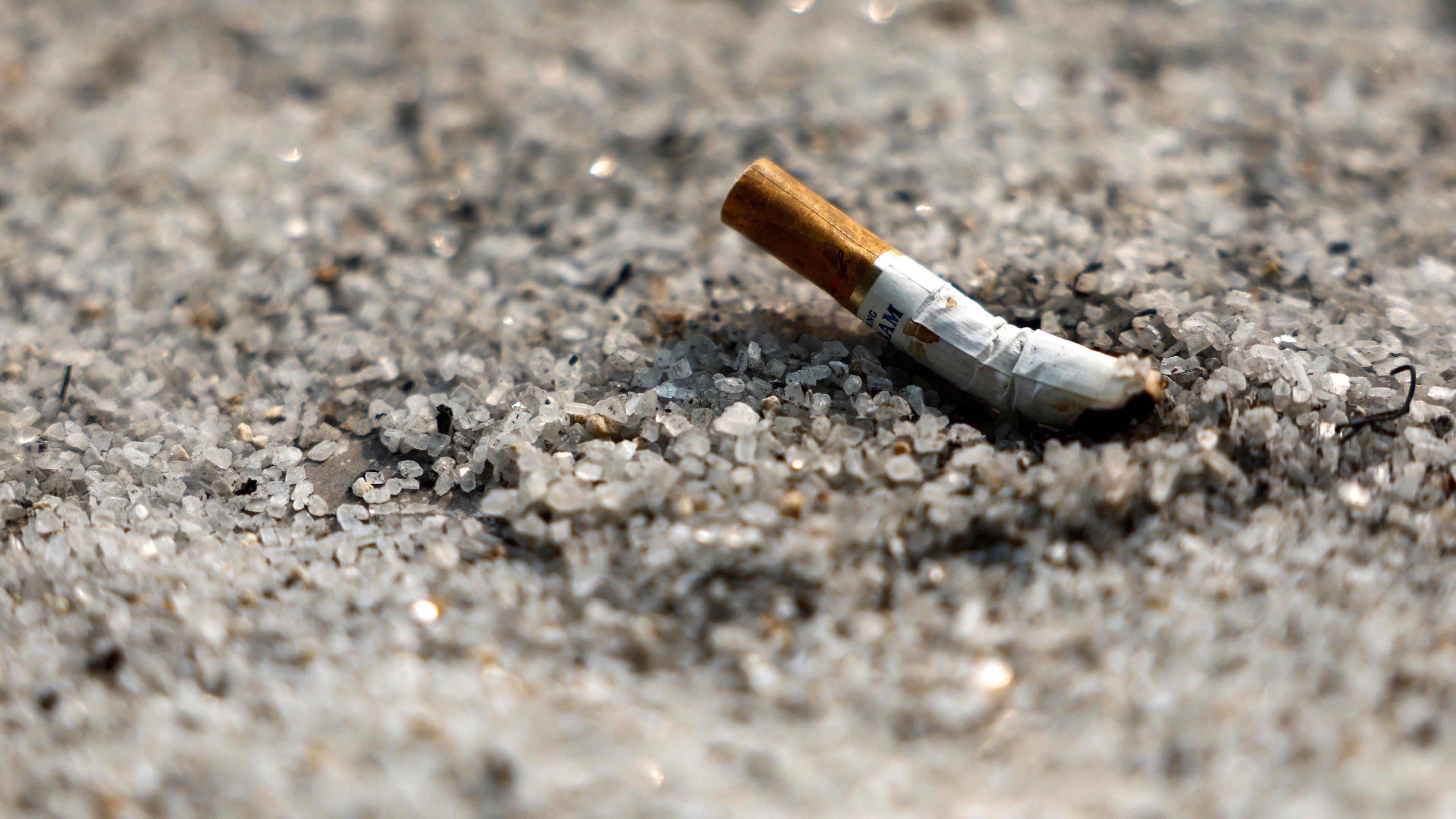 A cigarette butt in some sand