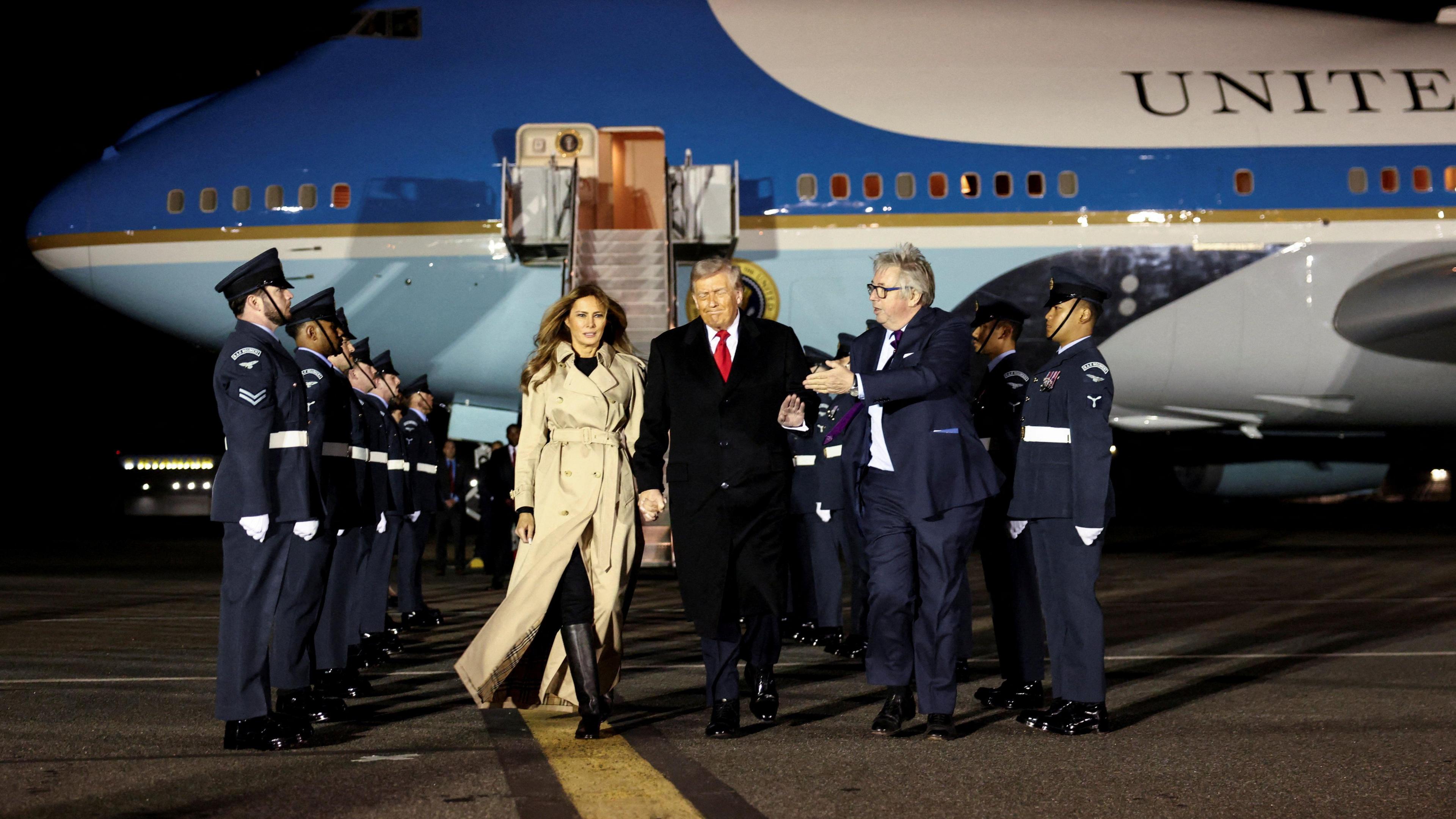 U.S. President Donald Trump and first lady Melania Trump are welcomed by Viscount Henry Hood upon arrival at London Stansted Airport for a state visit to Britain