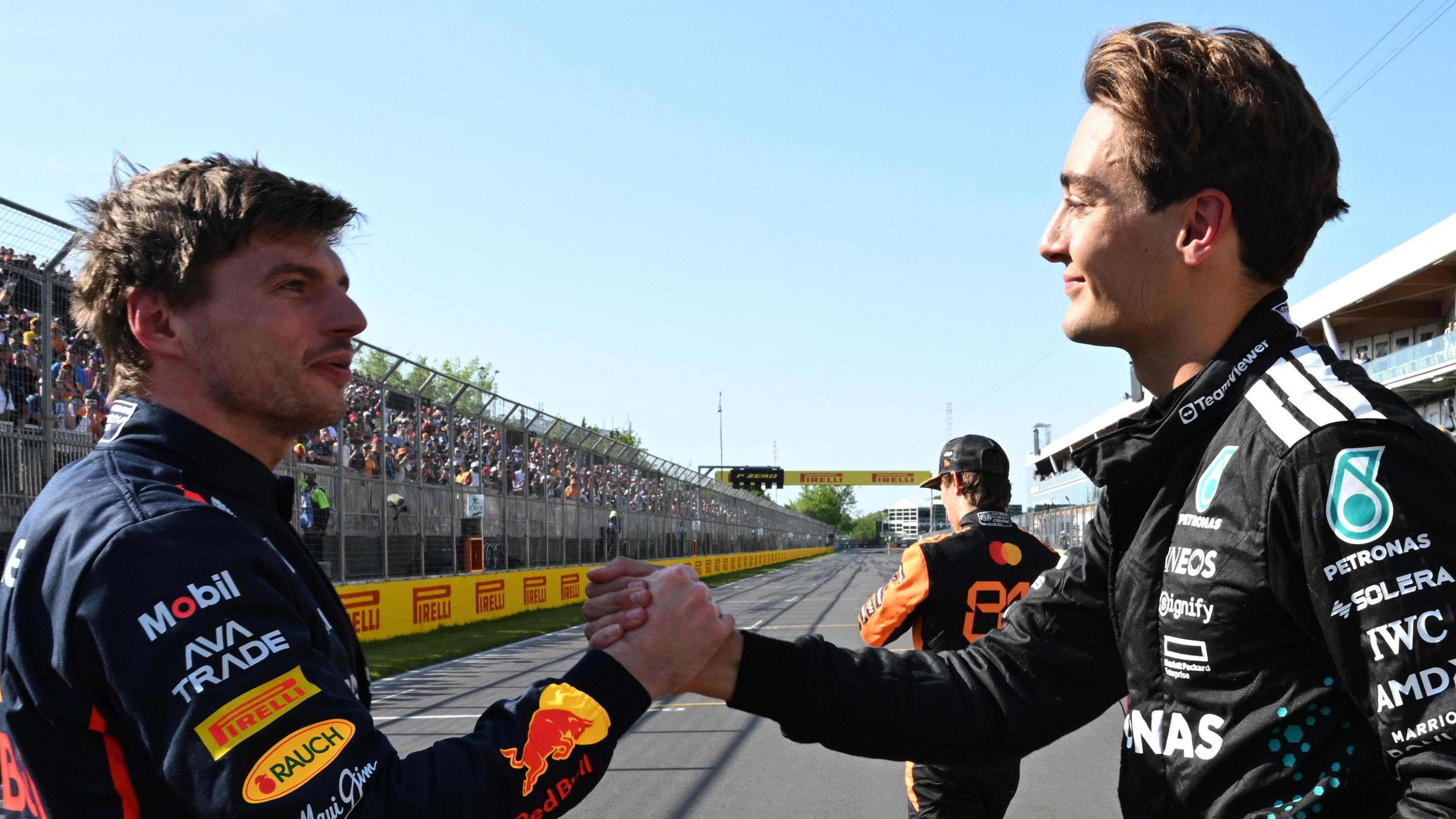 Max Verstappen and George Russell shaking hands after qualifying in Canada