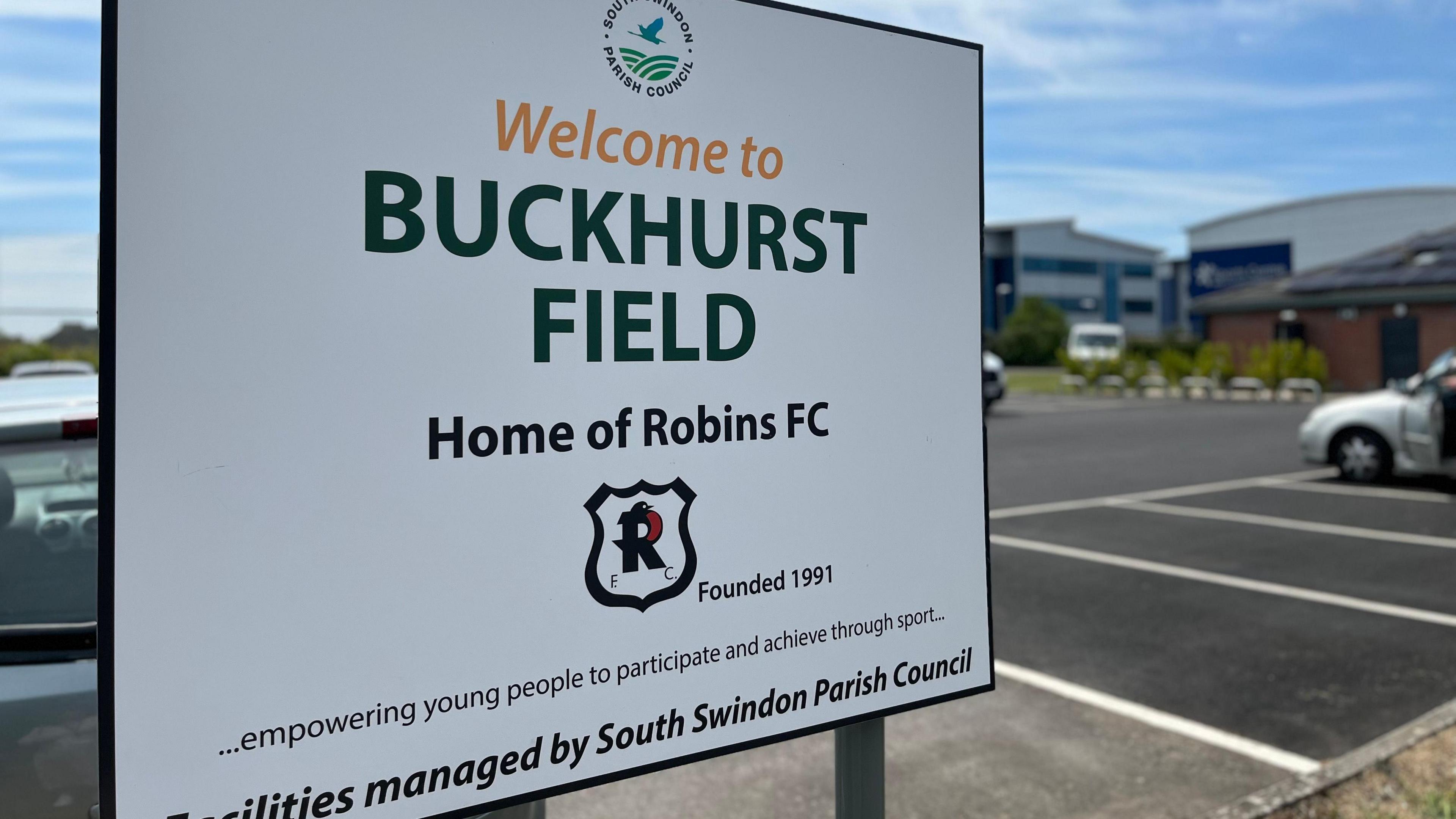 A sign sayign welcome to Buckhurst fields, Home of Robins FC.
