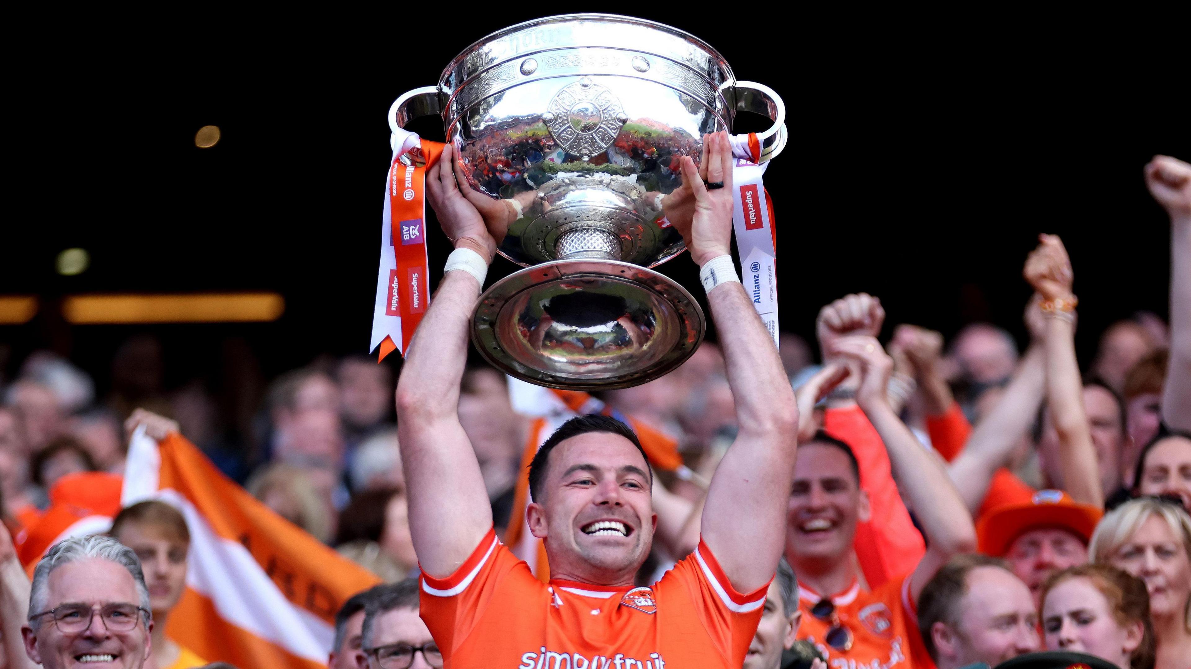 Aidan Forker lifts the Sam Maguire Cup
